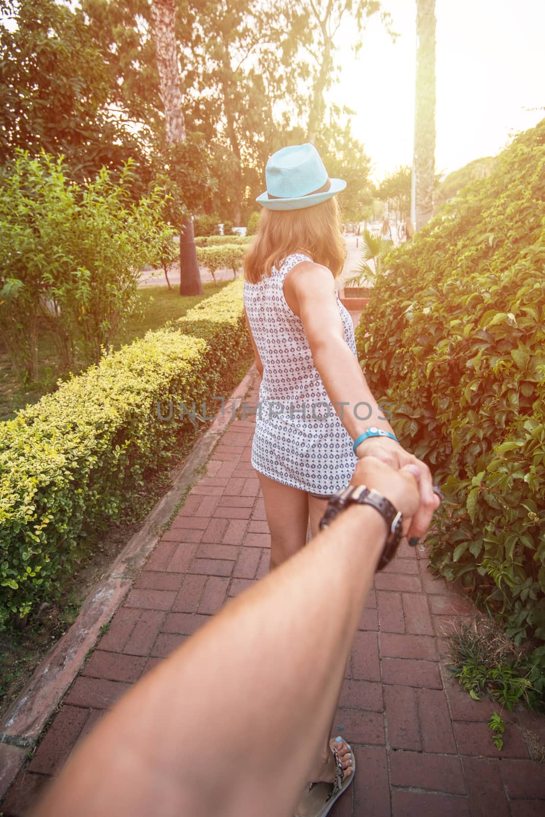 Girl holding a hand man on the street in Alanya, Turkey