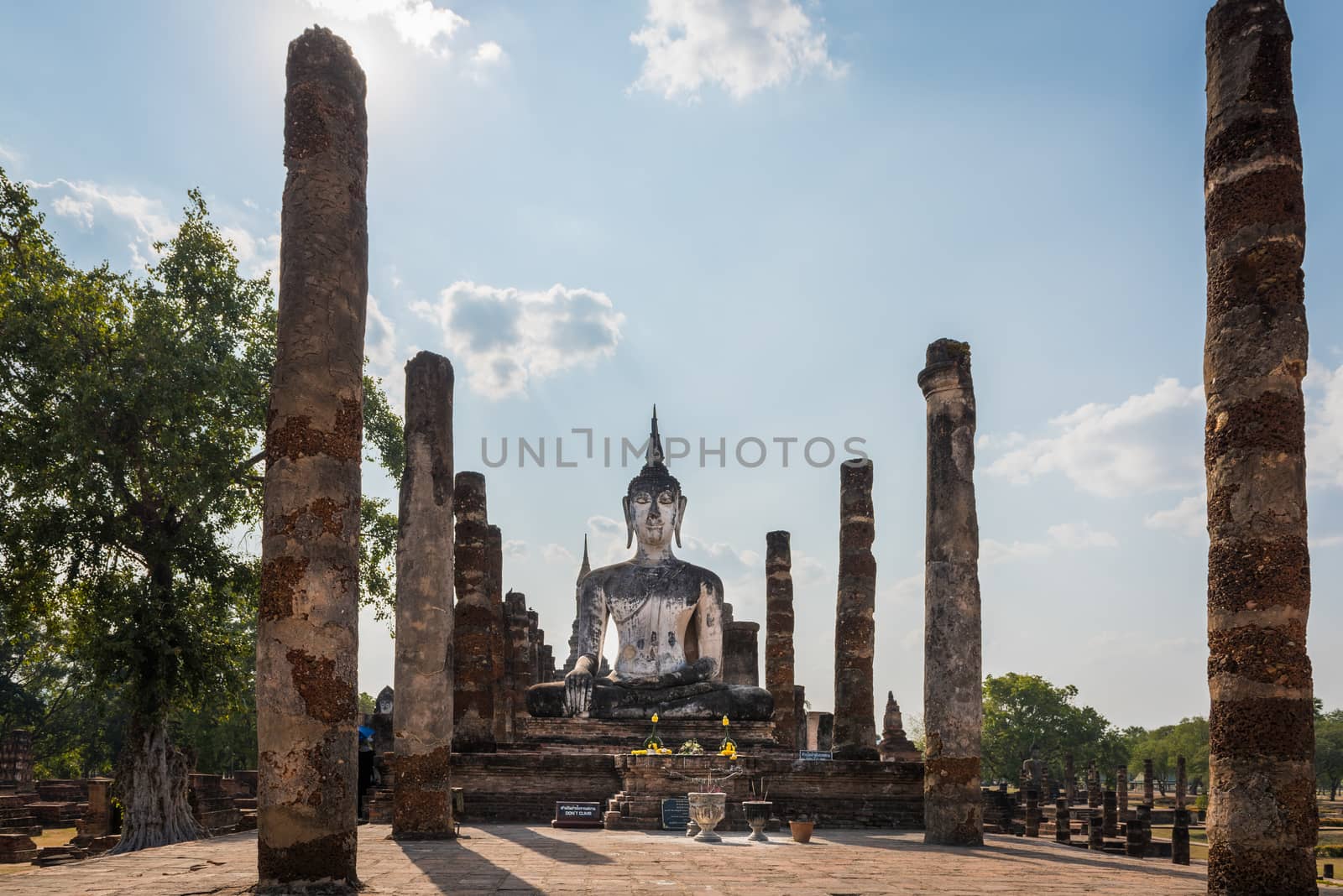 Wat mahatat, Sukhothai Historical park, Thailand.  Beautiful statue of Buddha smiling