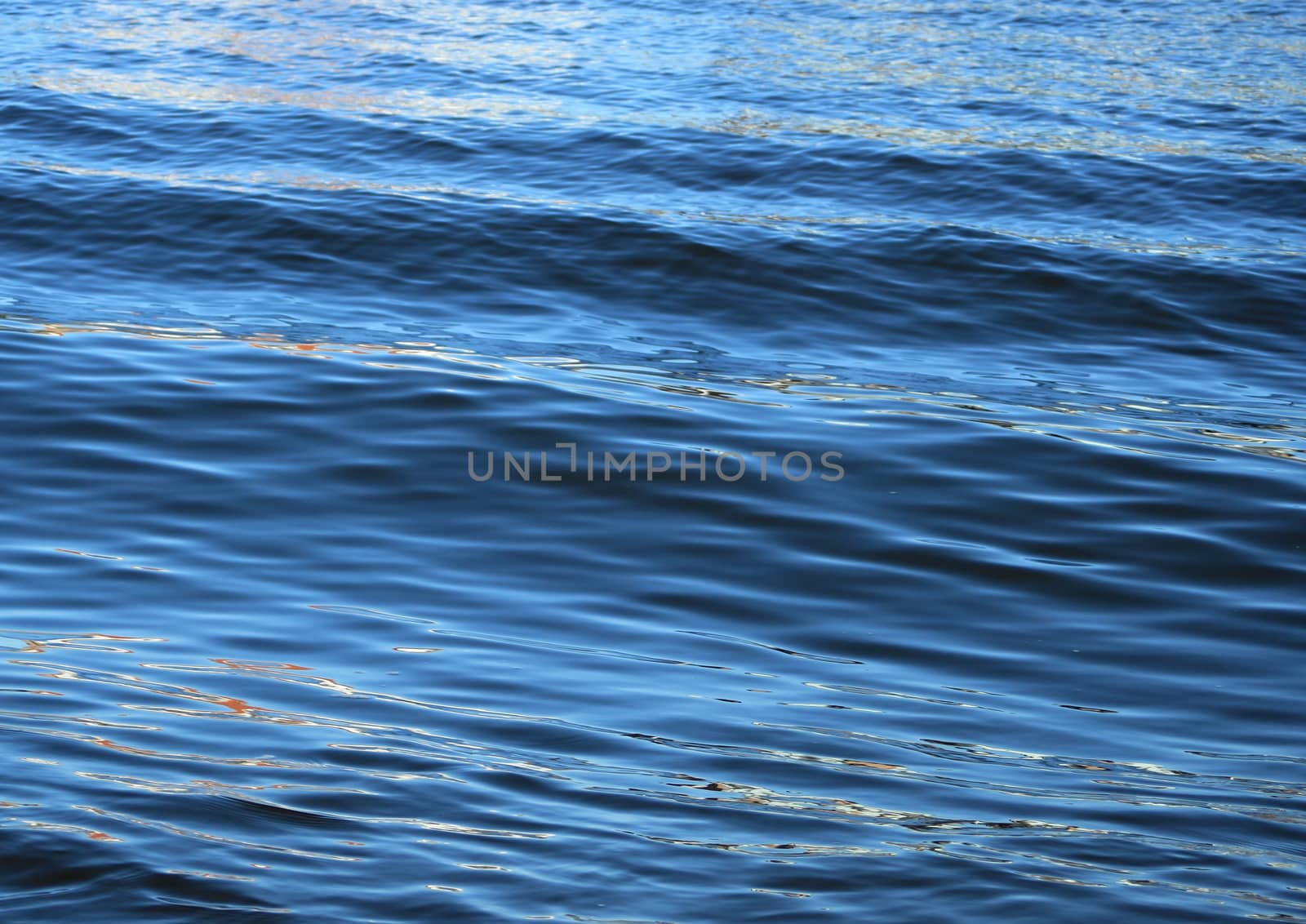 Soft blue wet wave at the coastline