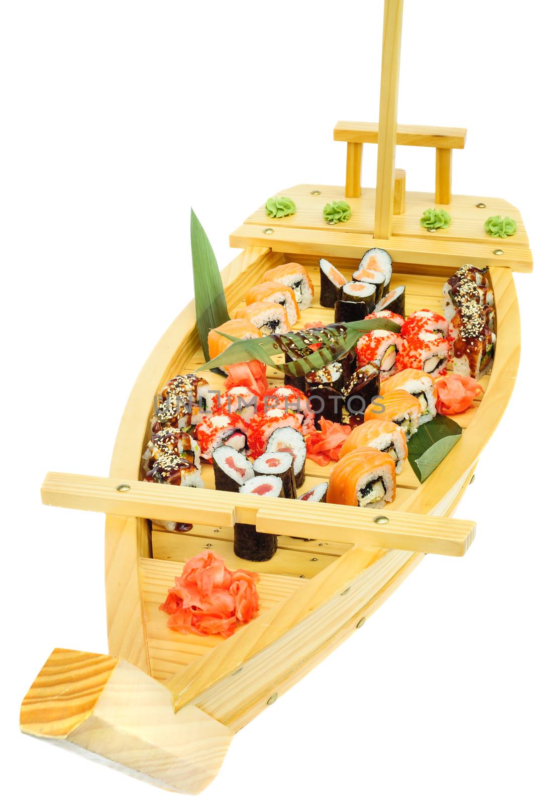 Sushi set of rolls on ship shaped plate by starush