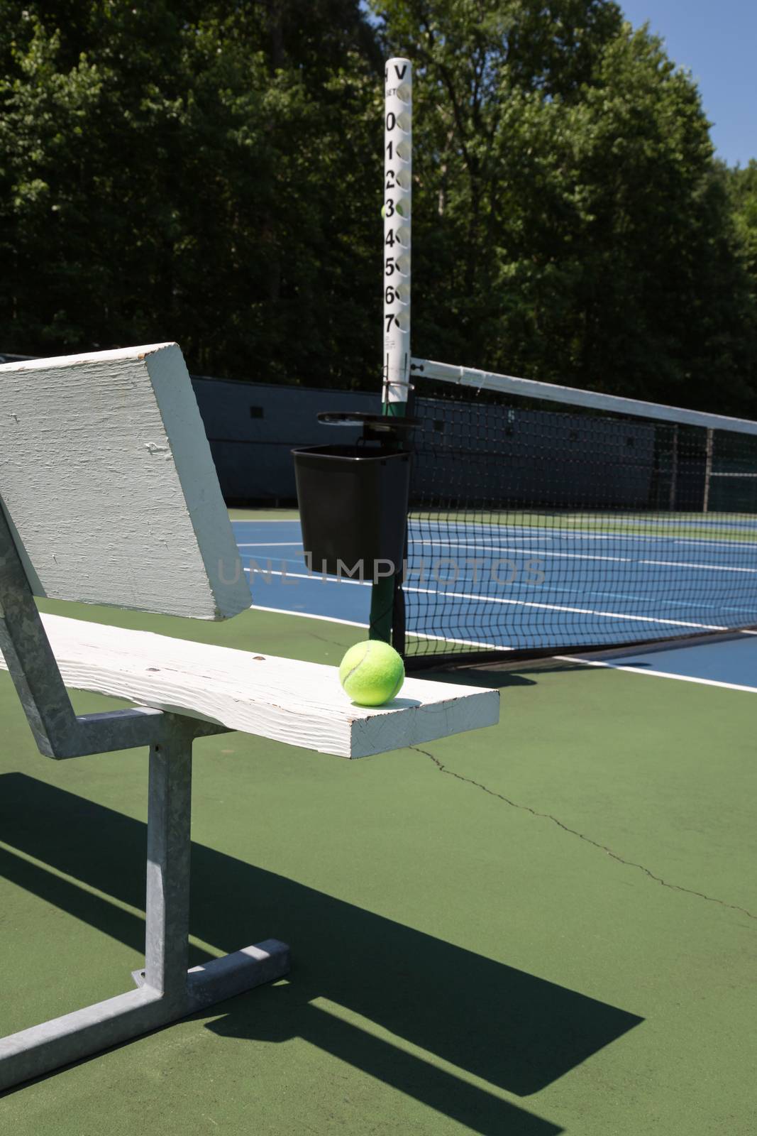 Tennis court sideline on a sunny day