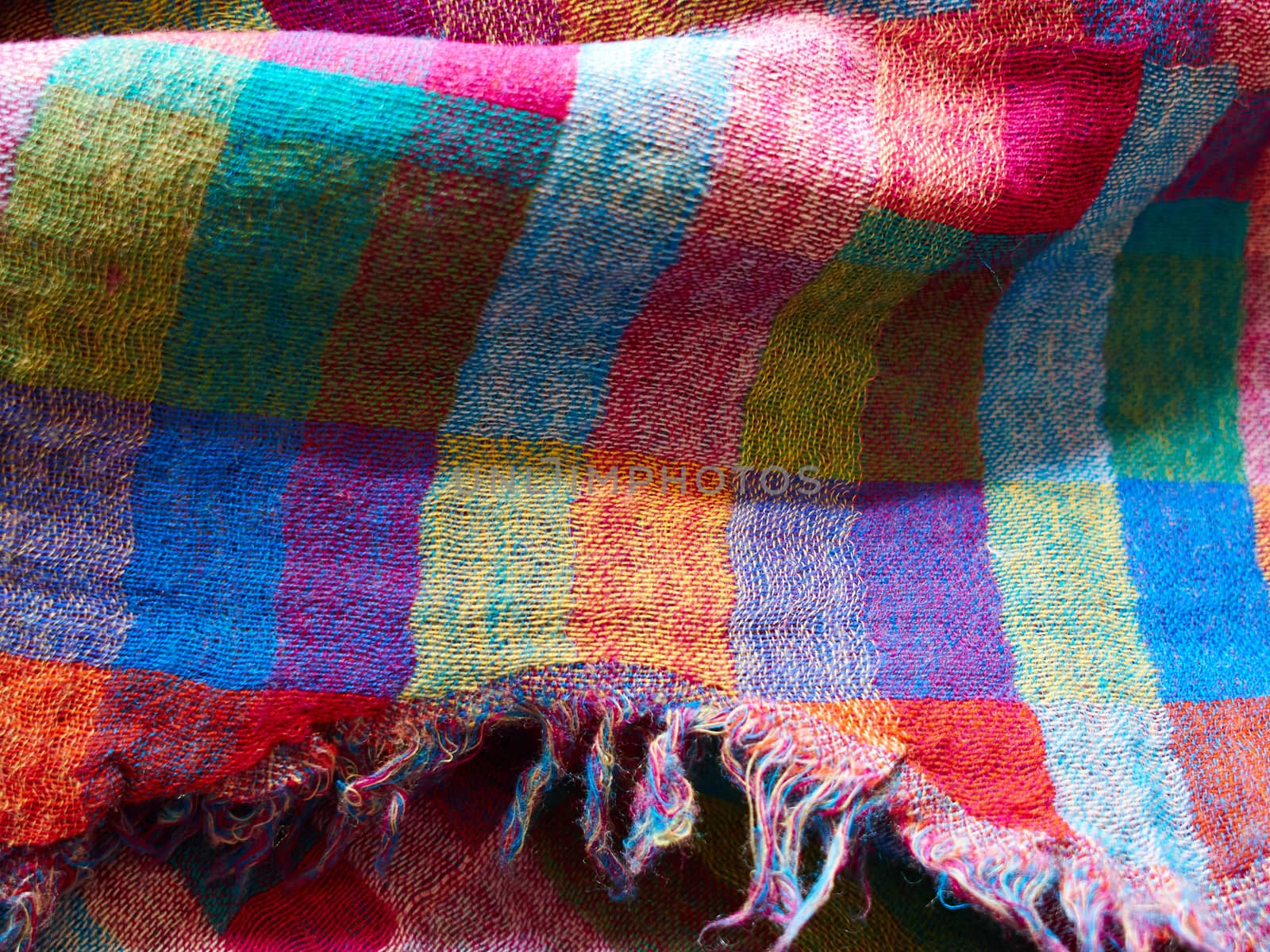 Colorful ethnic hand woven fabric material cloth on display in a market