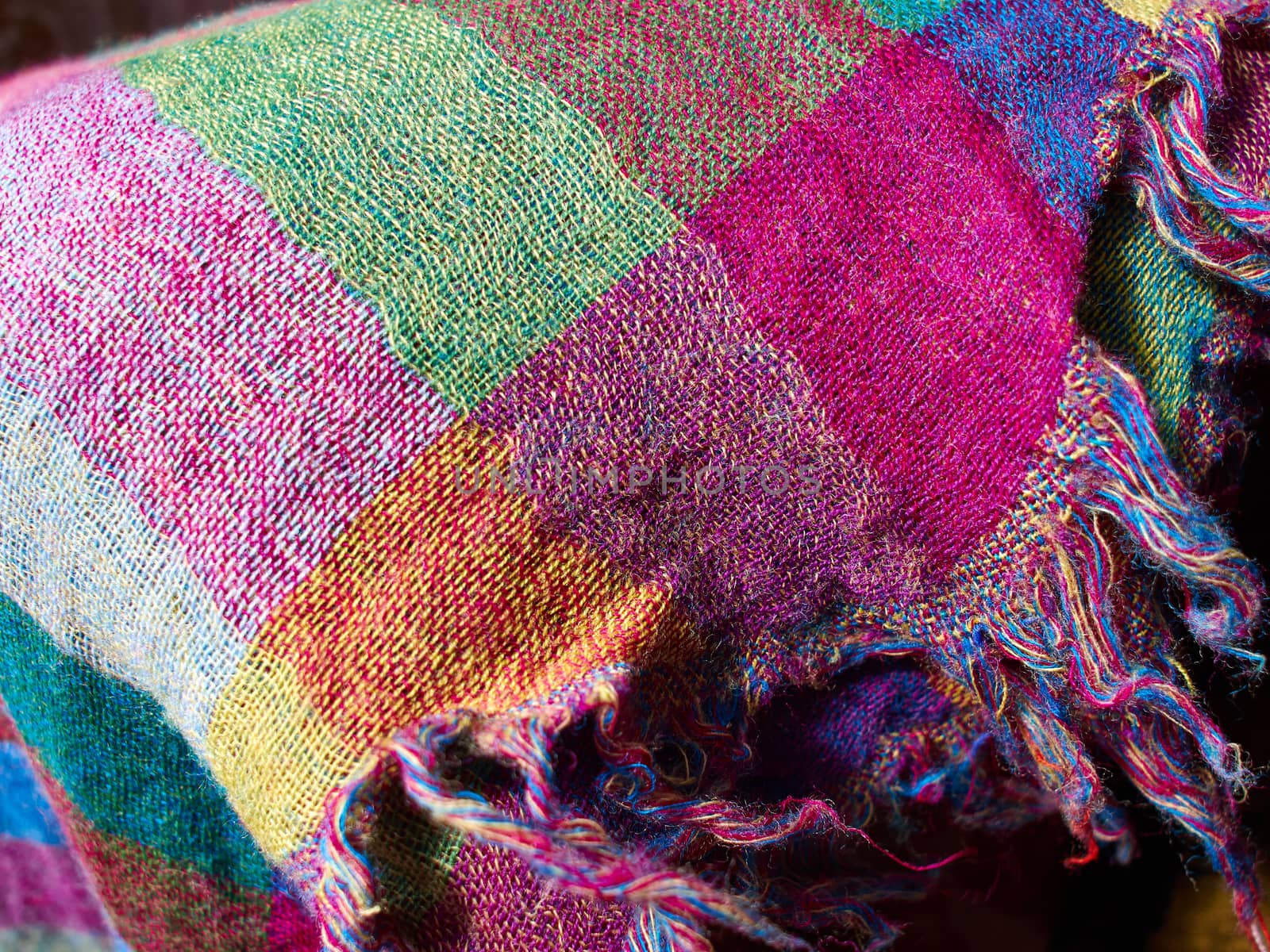 Colorful ethnic hand woven fabric material cloth on display in a market