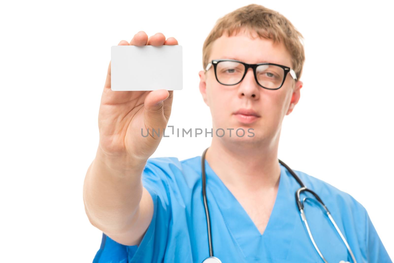 Male doctor shows a small blank for advertising focus on the hand