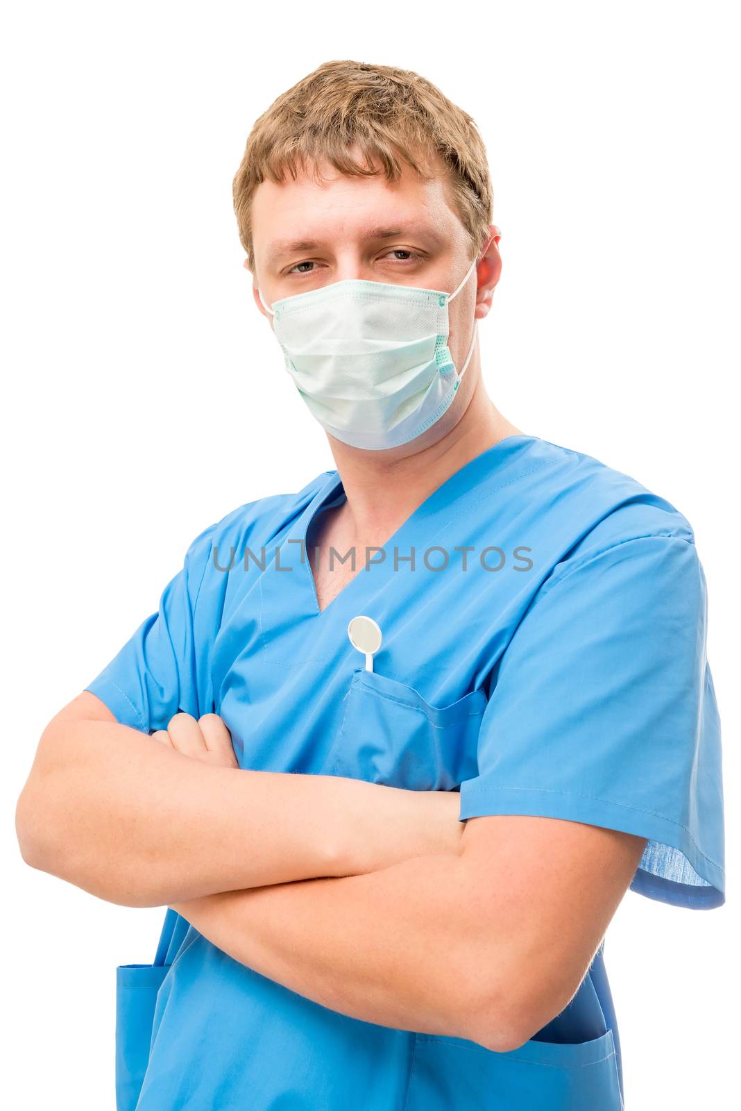 Vertical portrait of the doctor dentist in a mask isolated