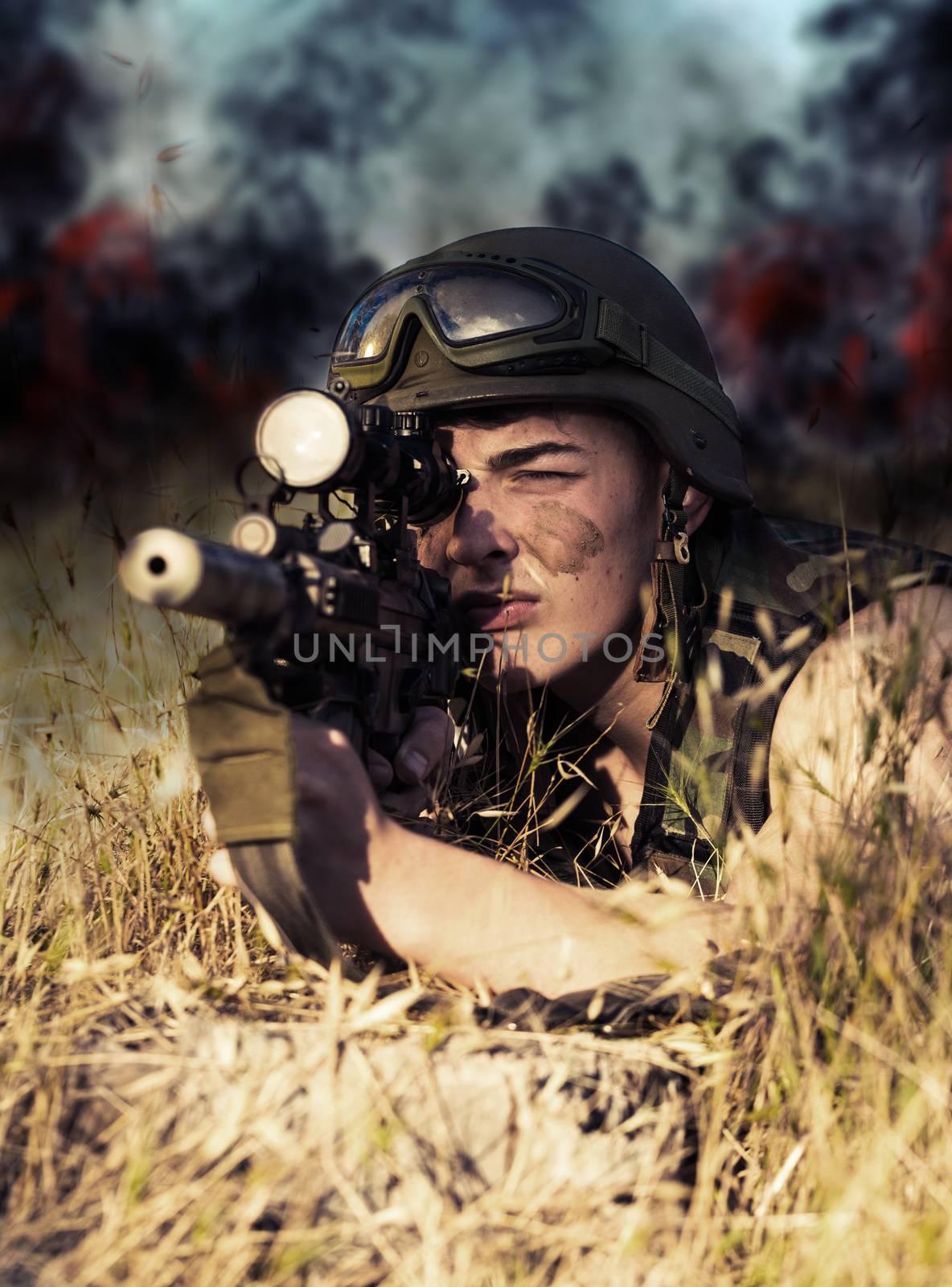 young a soldier in the uniform with weapon