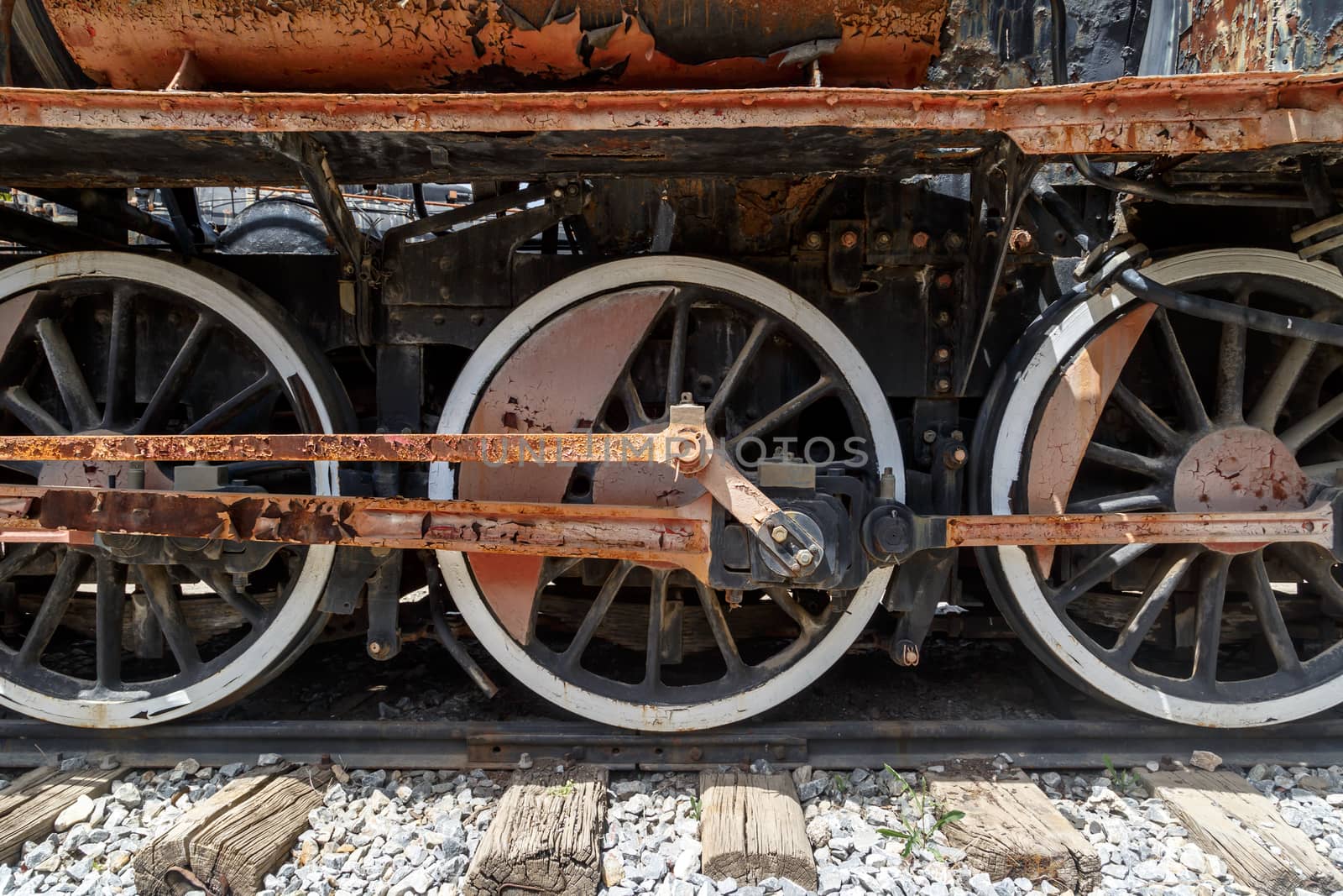 Close up detailed view of historical old rusty iron train locomotives.