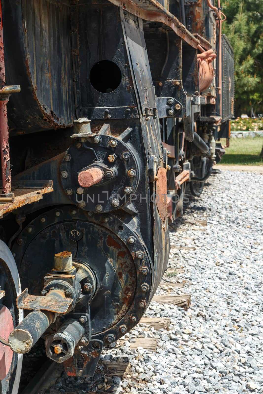 Close up detailed view of historical old rusty iron train locomotives.