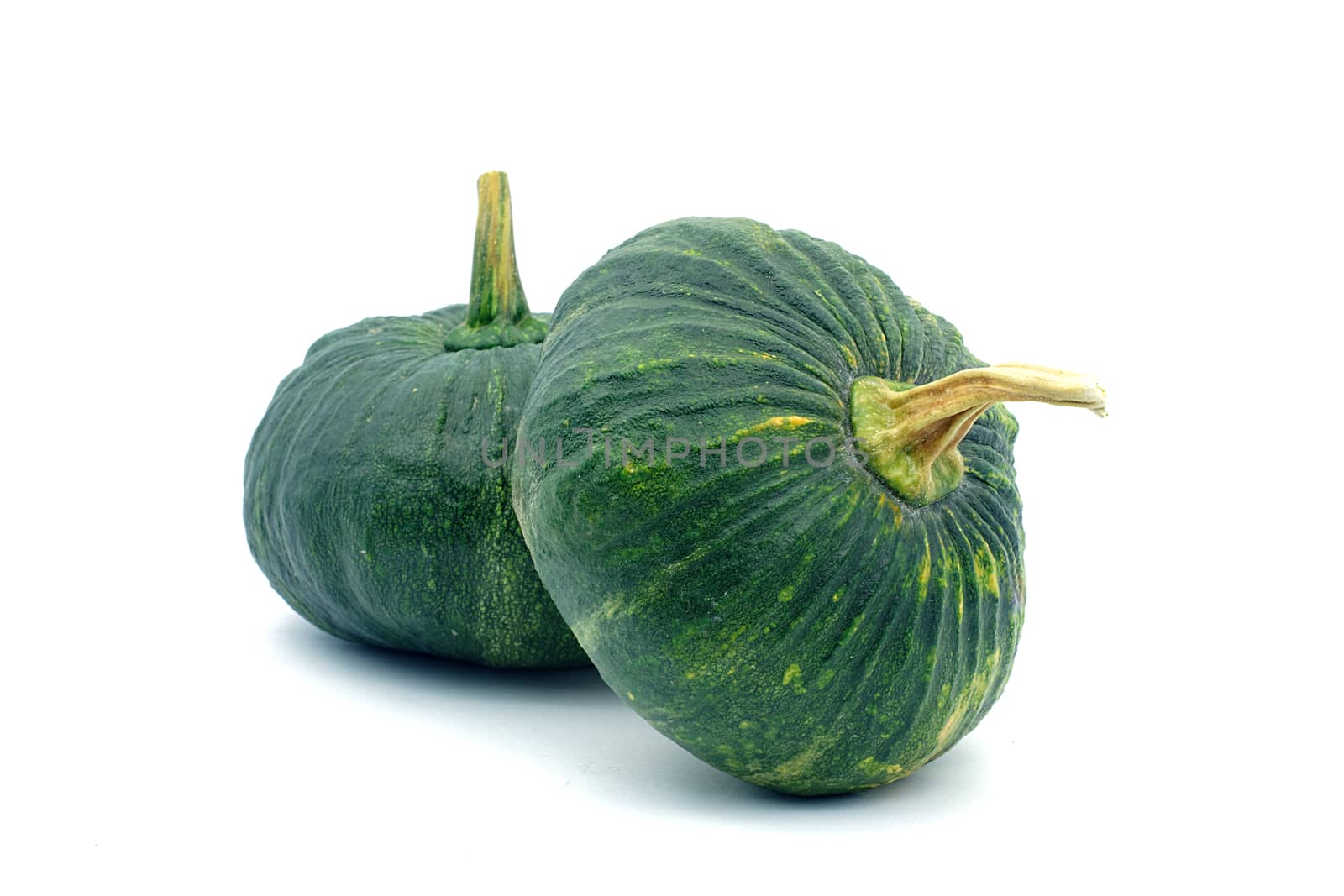 Double green pumpkin on white background. Two small green pumpkin on white background. object side view.