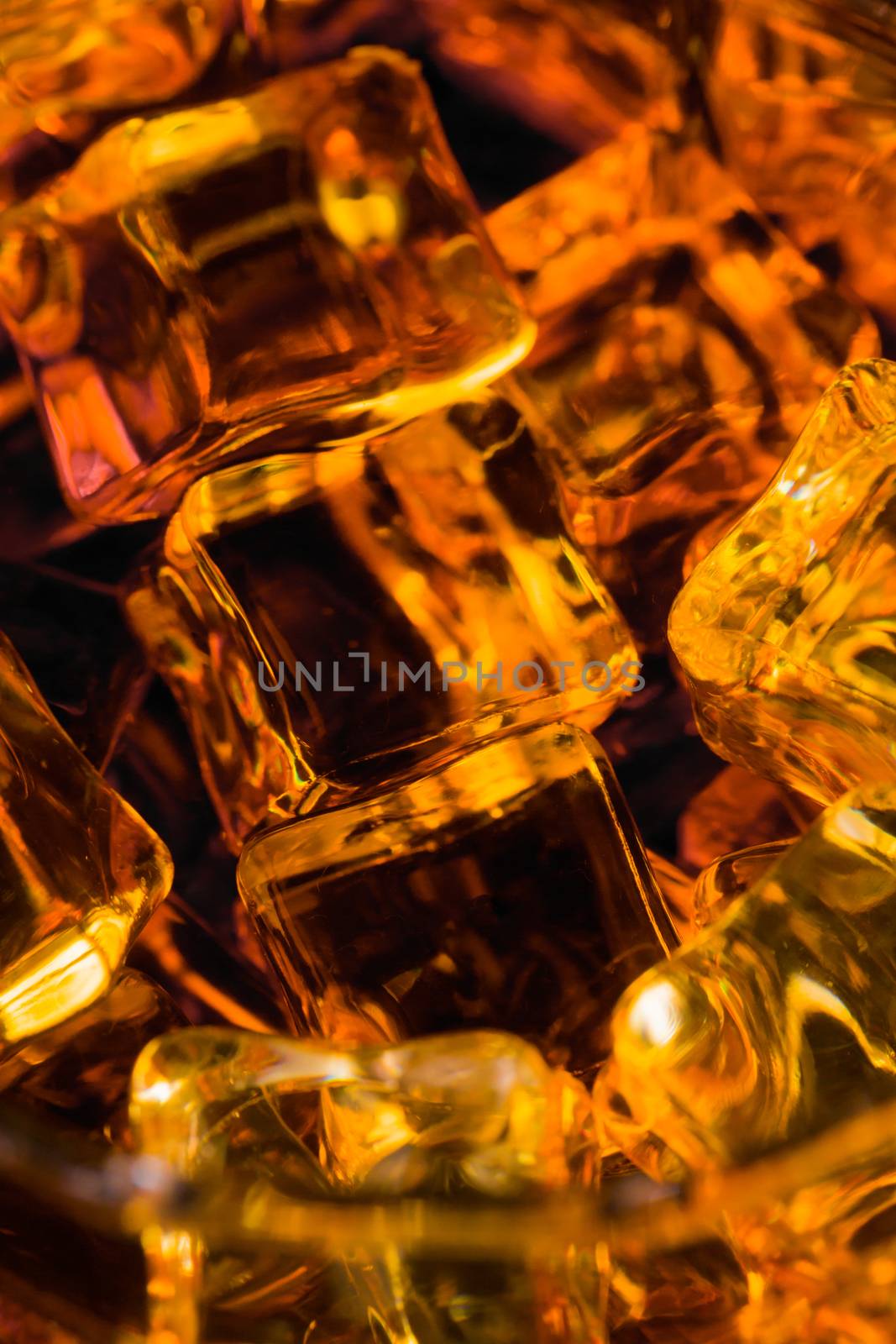 Whisky and Ice on a black glass table