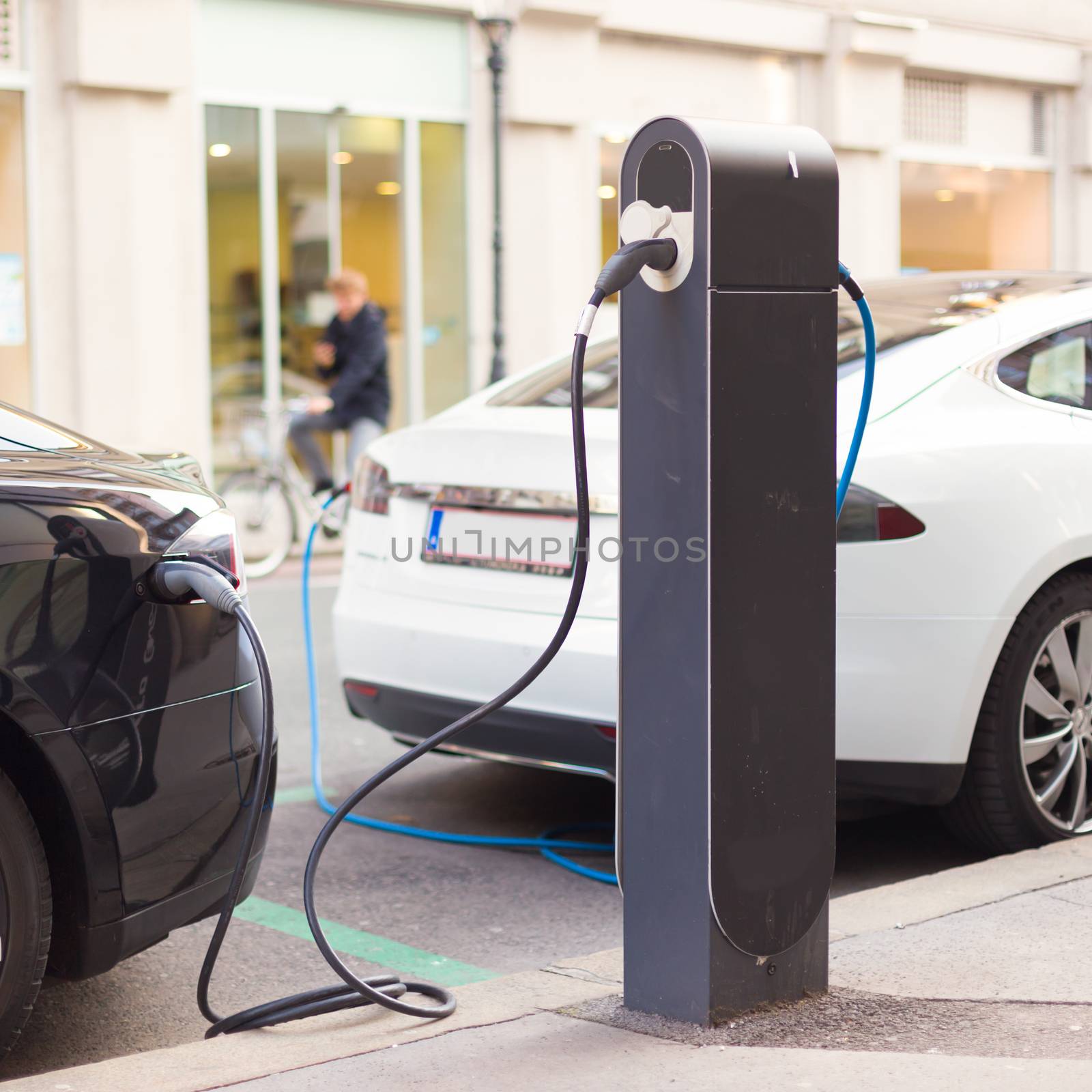 Electric Cars in Charging Station. by kasto