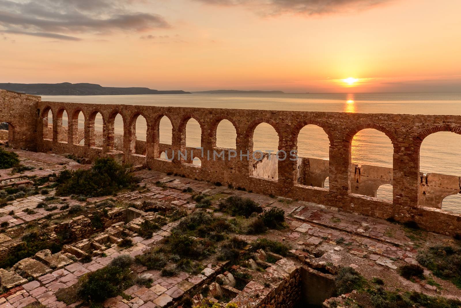 Ruins of industrial mining along the west coast of Sardinia. Panorama at sunset. The Marmora washery.