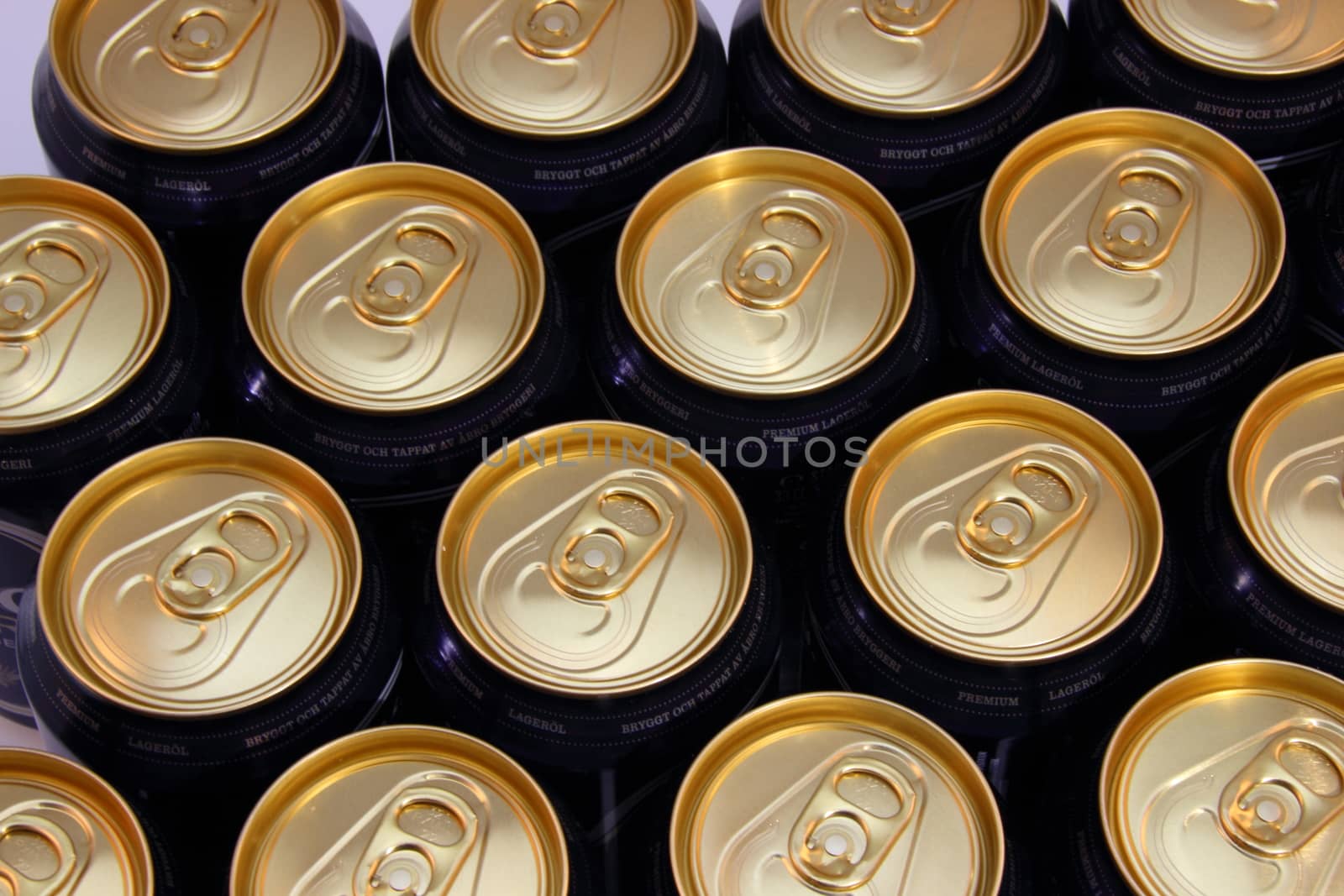 Top view of beer cans with golden top