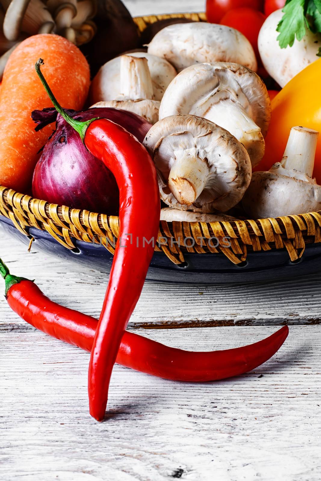 Vegetable set fresh mushrooms,peppers,onions on light background