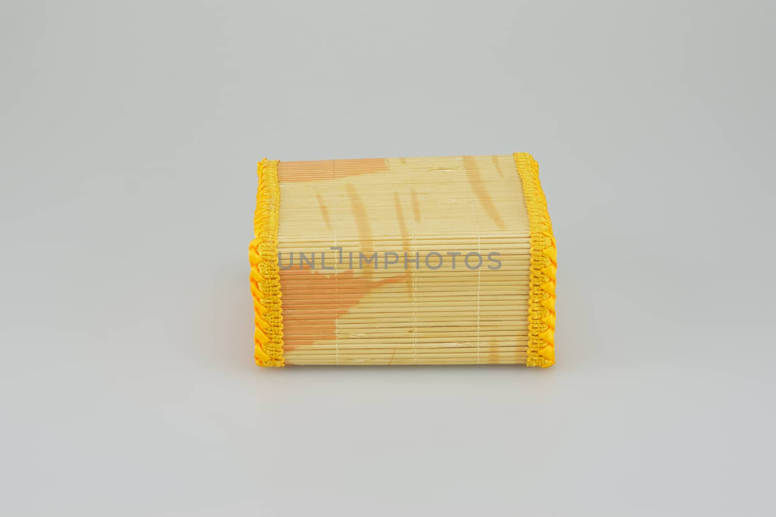 Square shaped bamboo box  on white background, handicraft from Thailand.