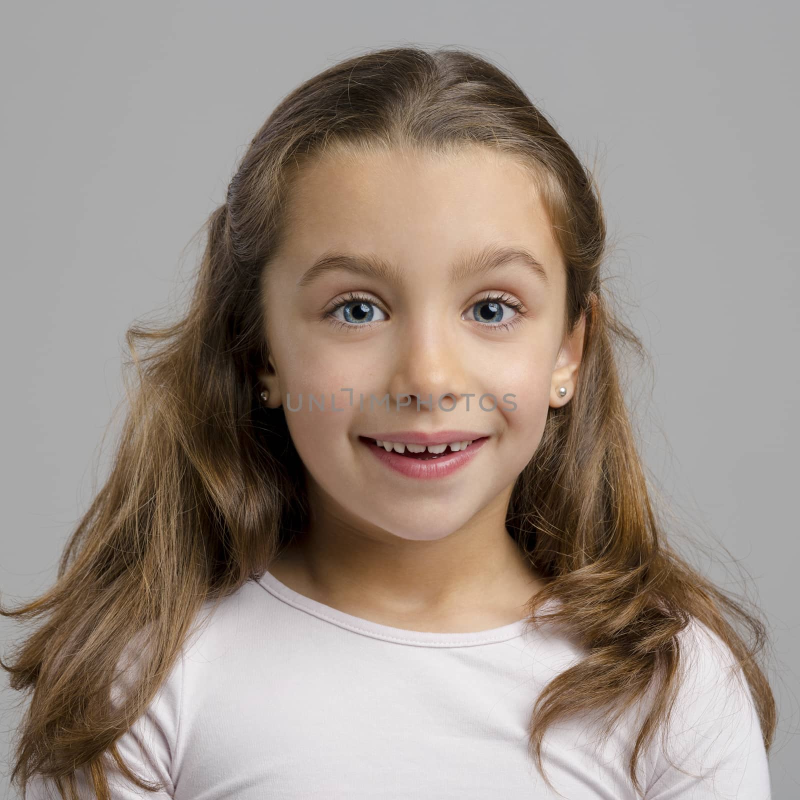 Portrait of a little girl with a smiling expression