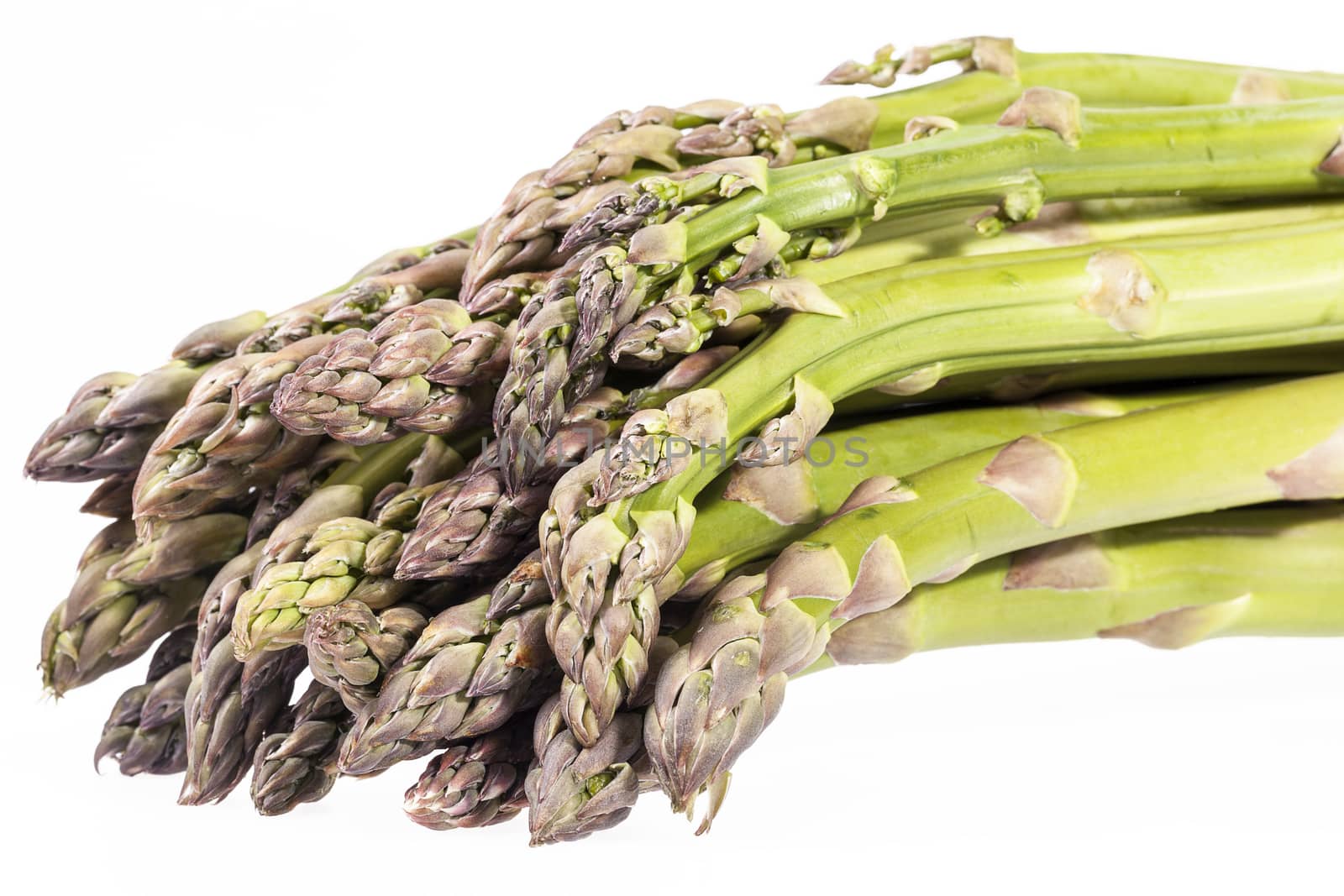 heap of green asparagus  vegetables isolated on white background.