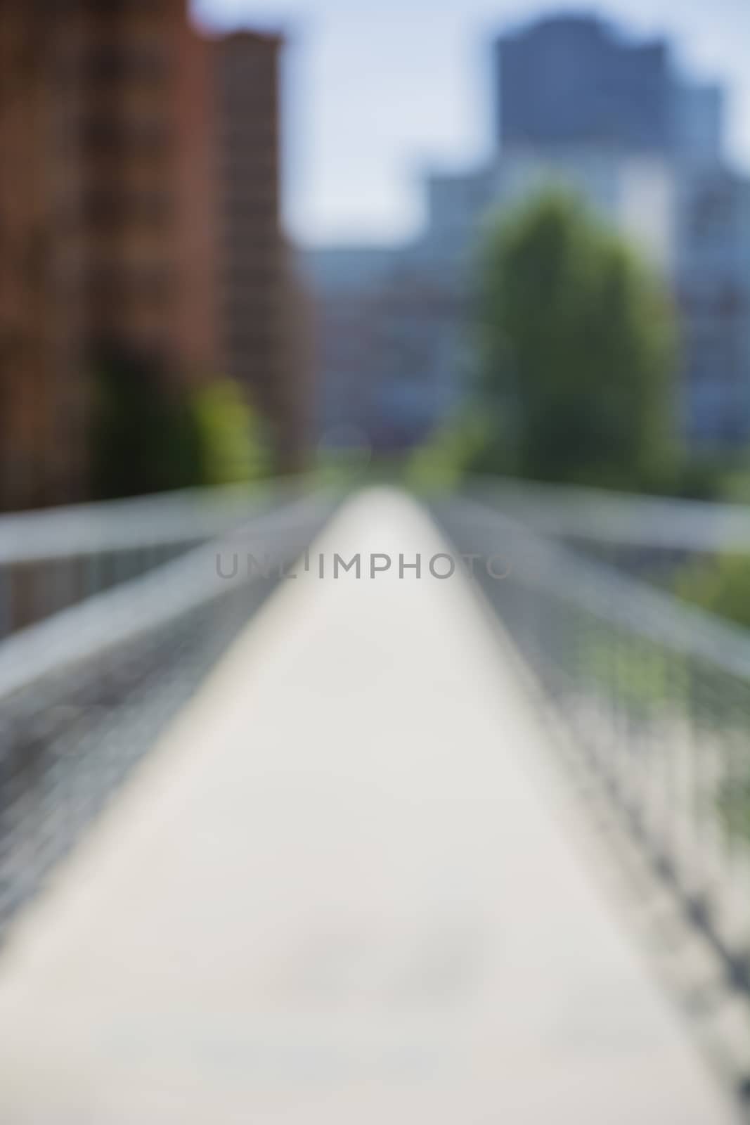 View on blurred corridor or alley in city setting by artofphoto