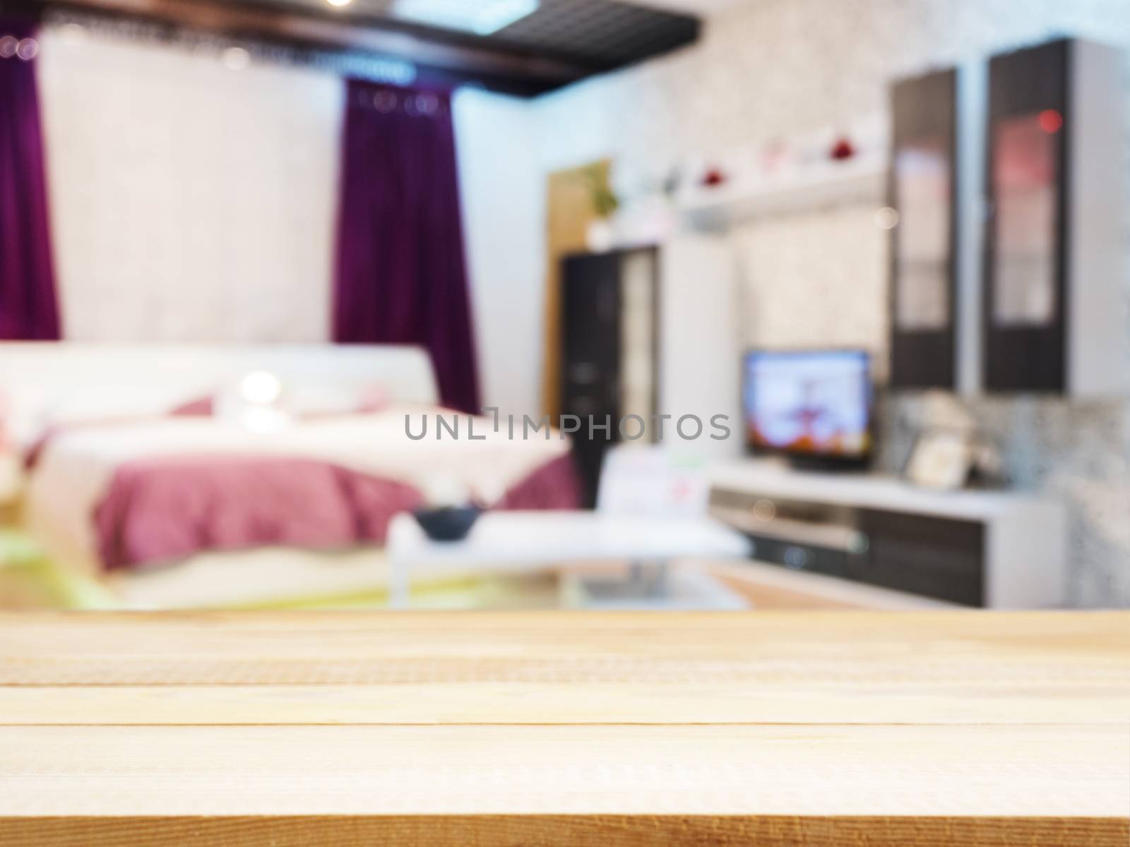 Wooden empty table and blur living room interior by fascinadora