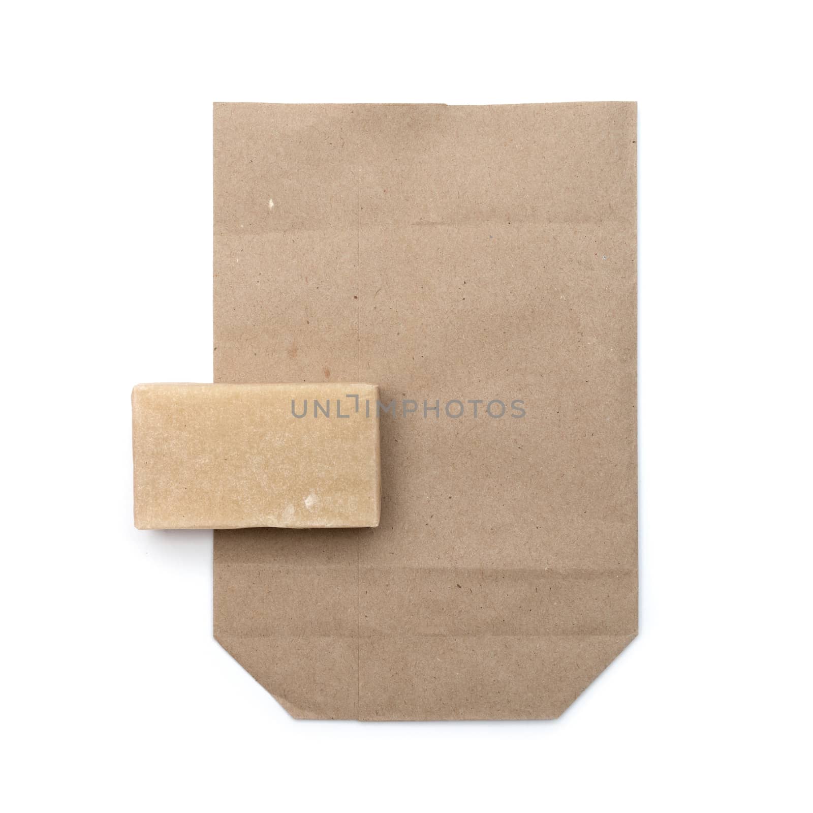 Brown paper bag isolated over white background by DNKSTUDIO