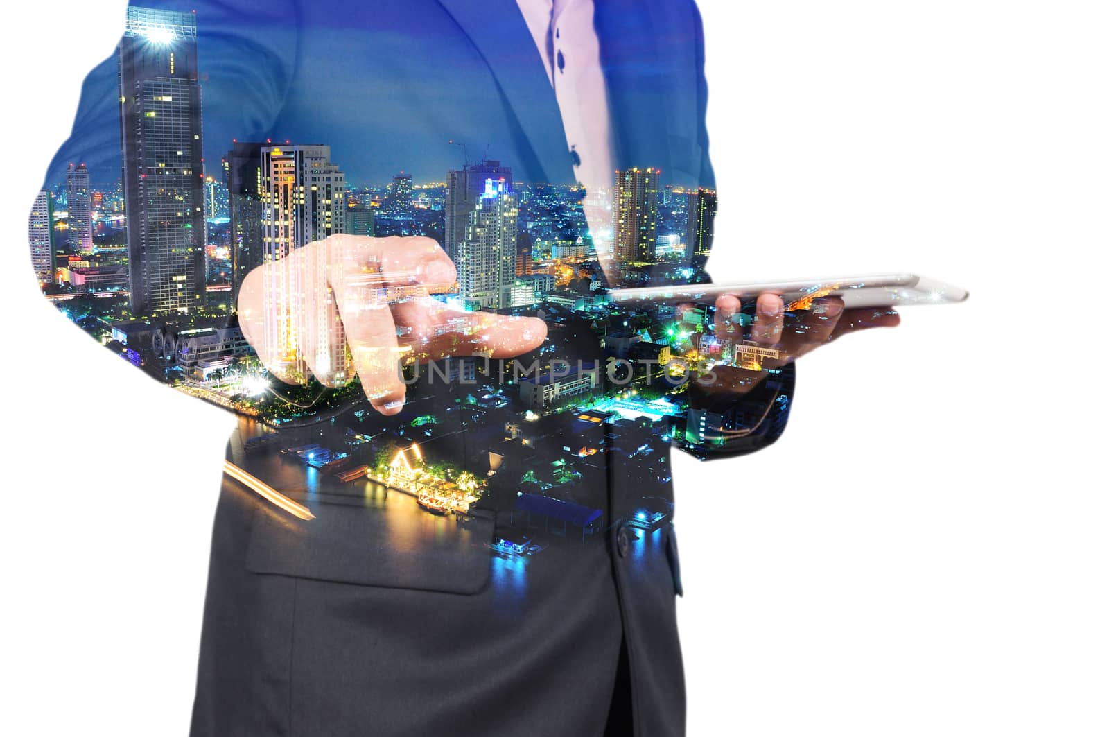 Double Exposure image of Businessman use Digital Tablet and City Building at Twilight
