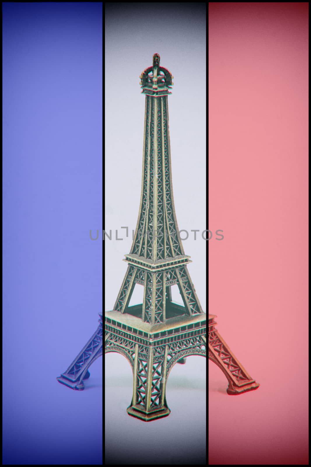 Eiffel Tower model on french flag. Dust and scratches applied for vintage analog effect