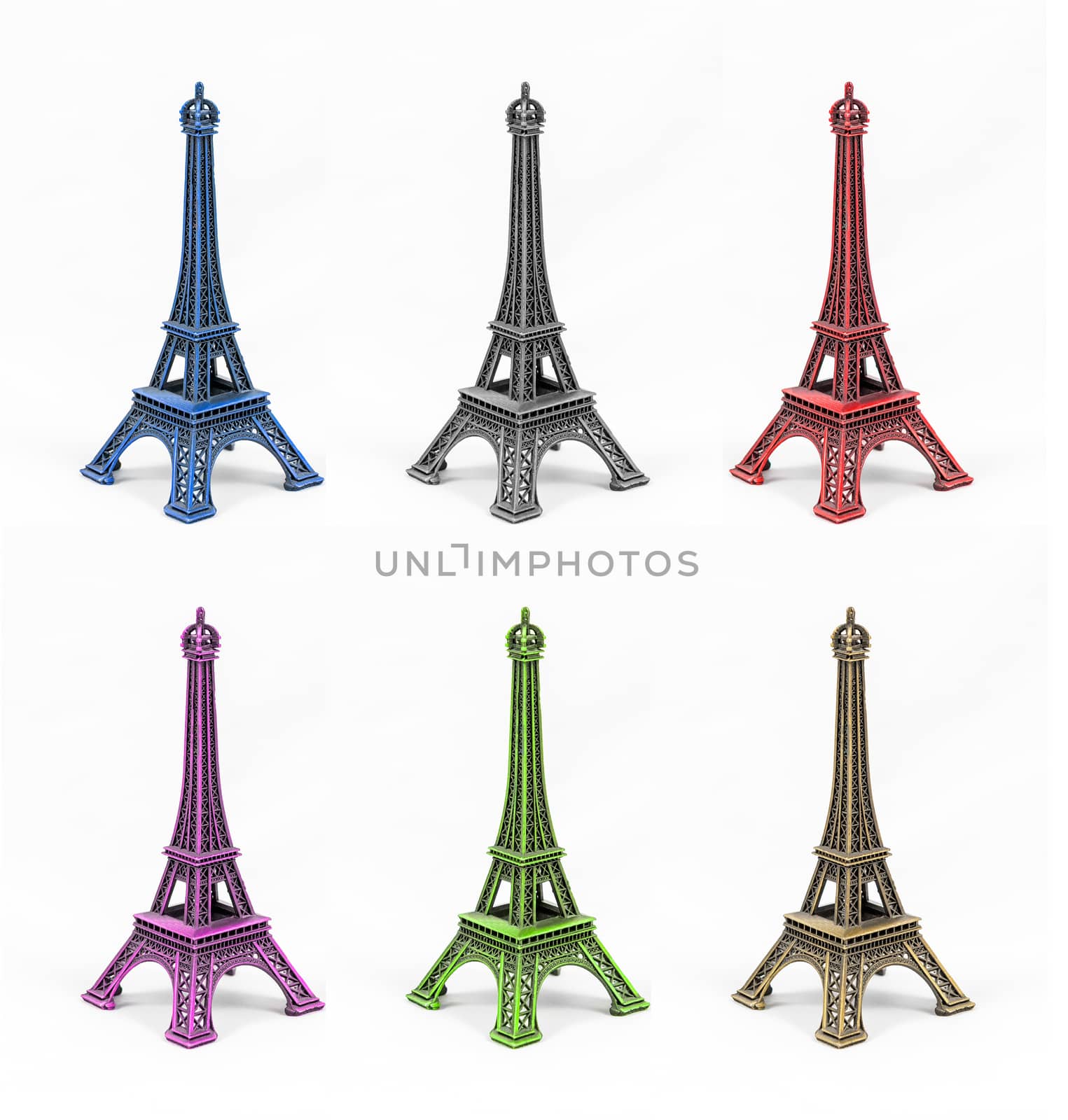 Six multicolored Eiffel Tower models, isolated on white background. Concept for multiethnic Paris