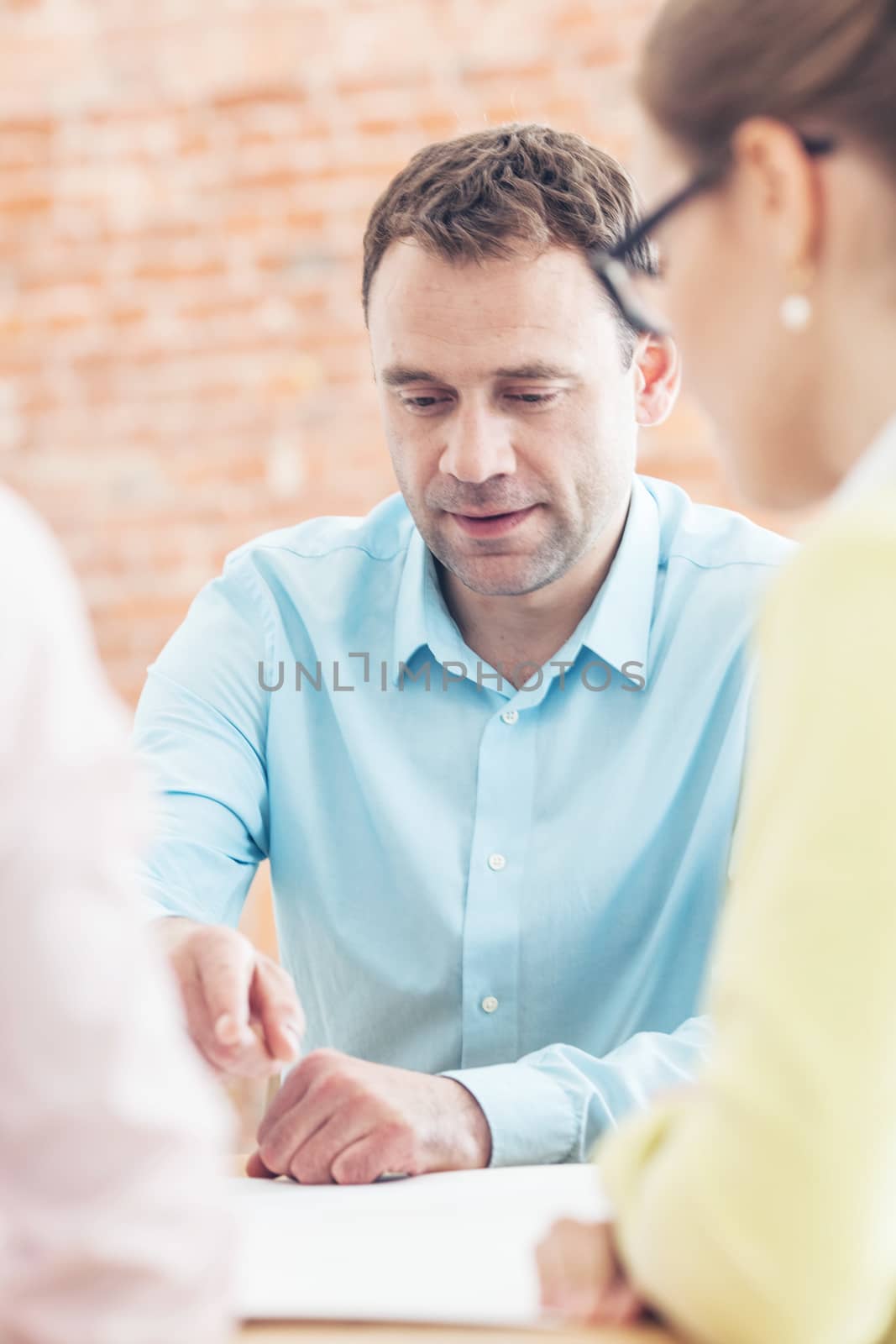 Business team of people in casual talking at meeting table