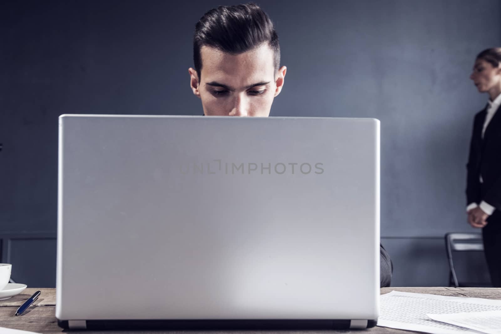 Business man working with laptop computer in office