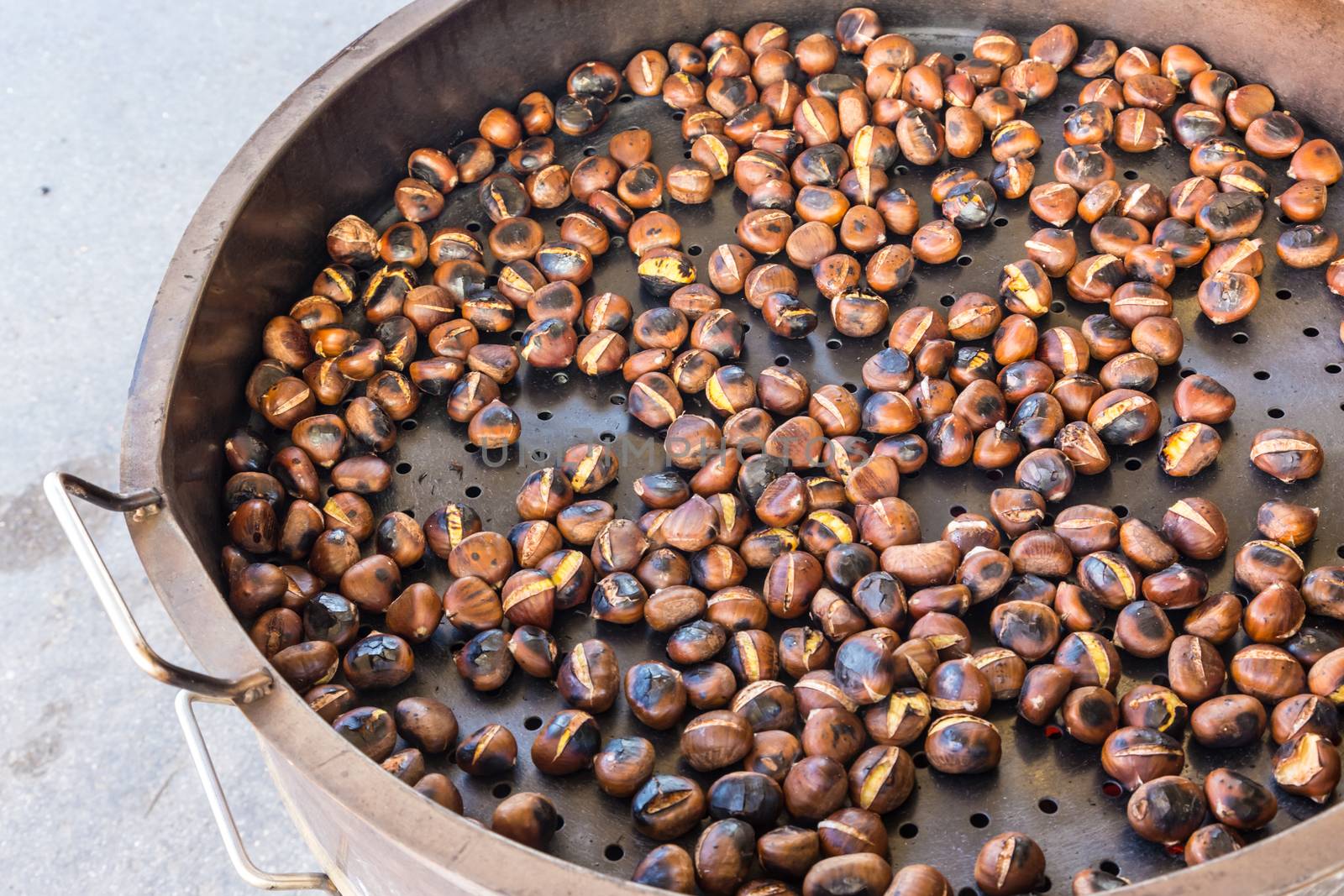 Grilled chestnuts being selled at stalls in autumn.