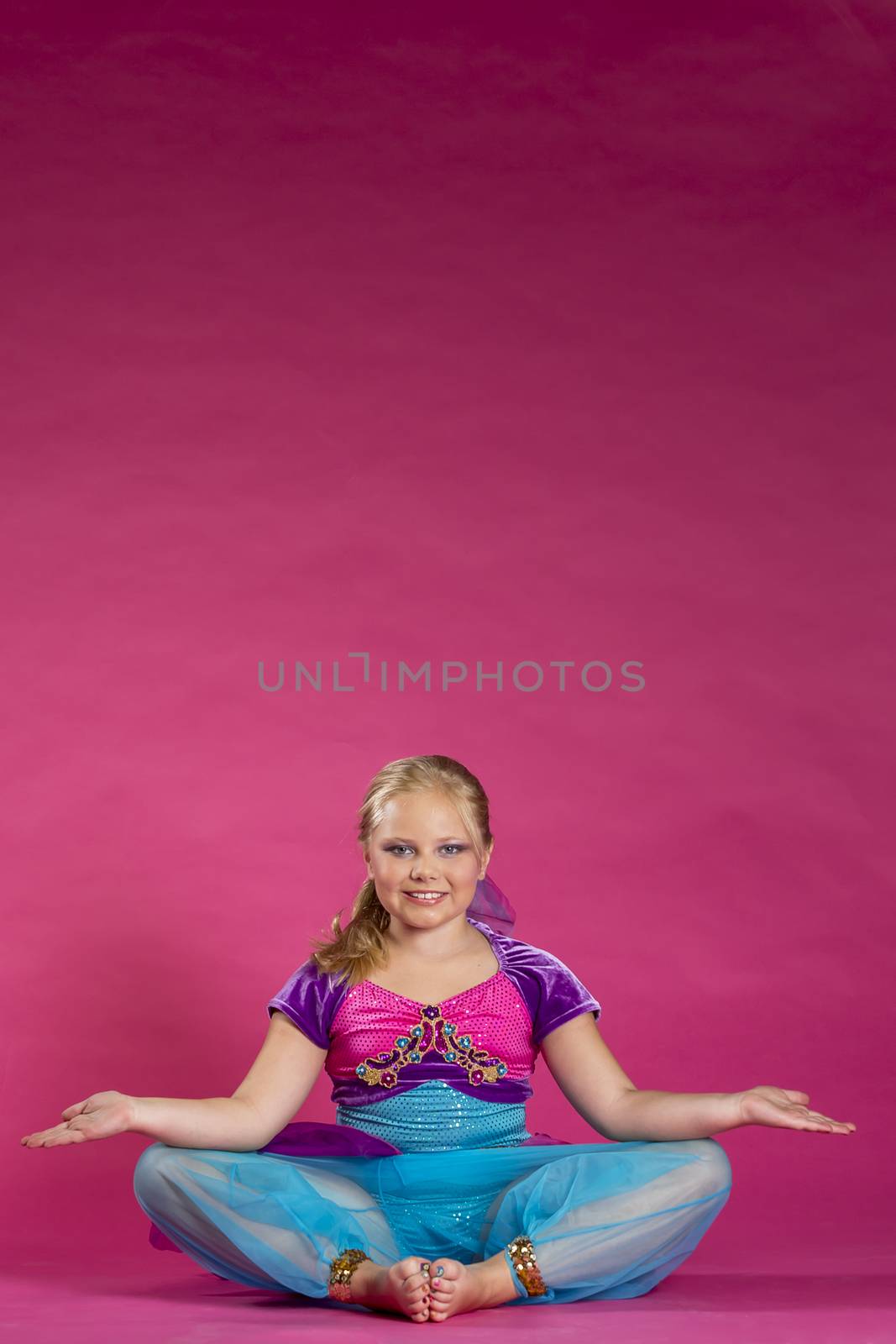 A young child posing in a studio environment