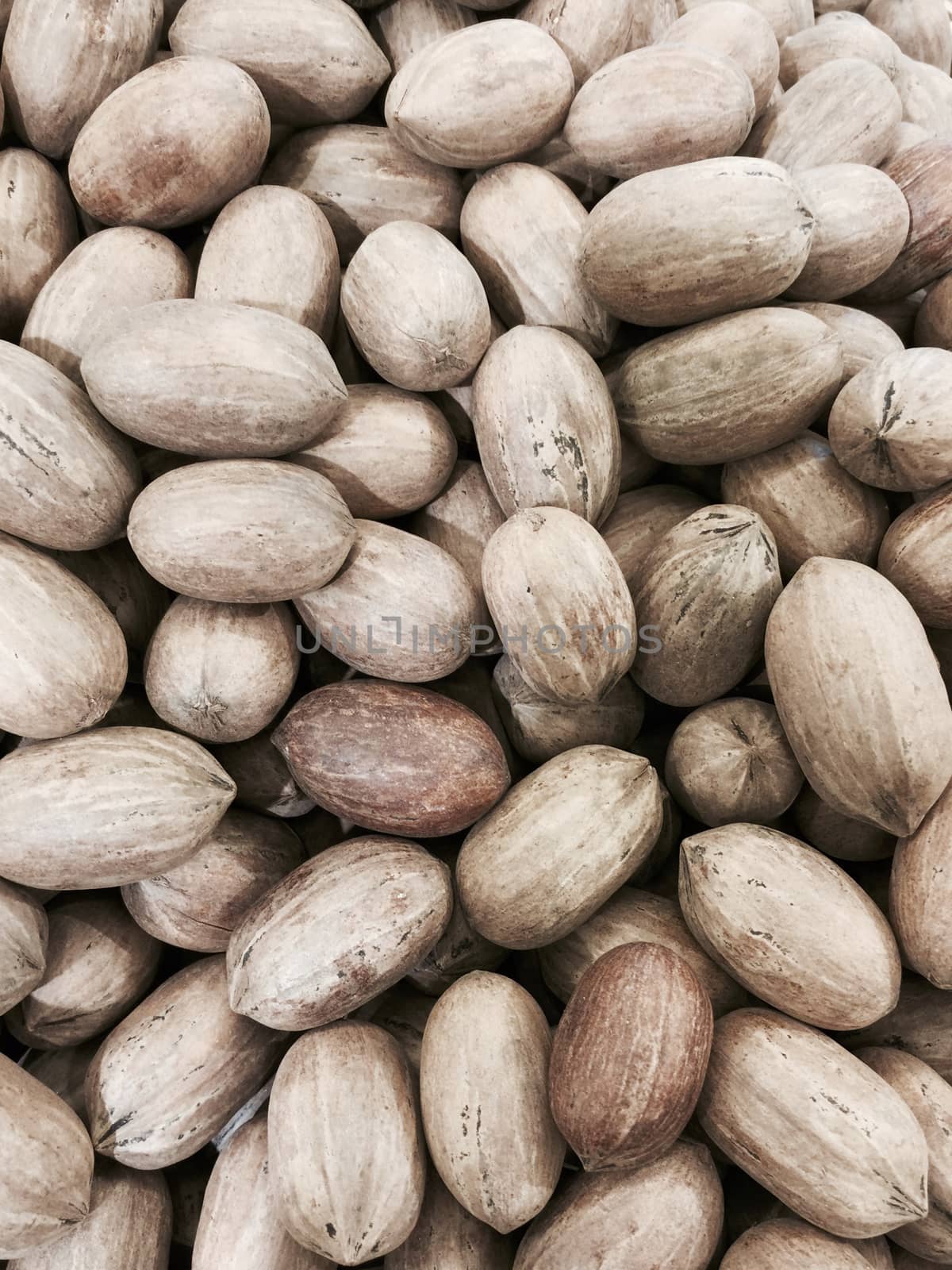 Pecan nuts in a market, healthy snack.