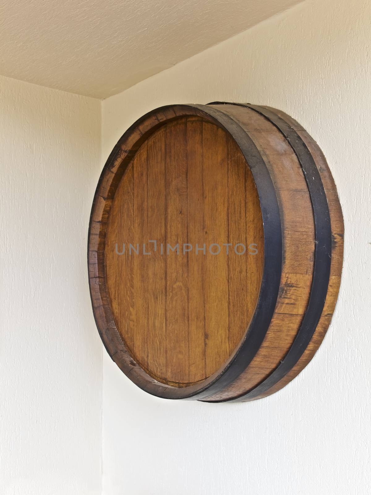 Wine round barrel on a wall, vineyard building