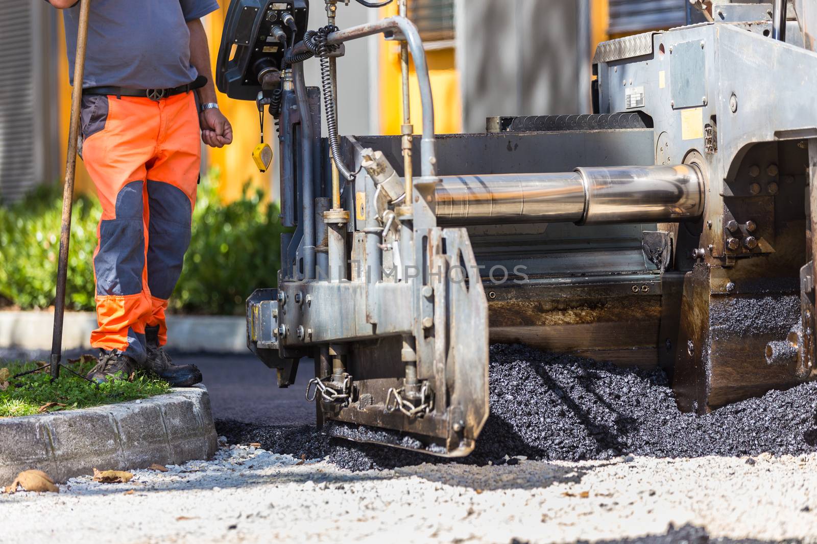 Heavy machiners construction works during asphalting road.