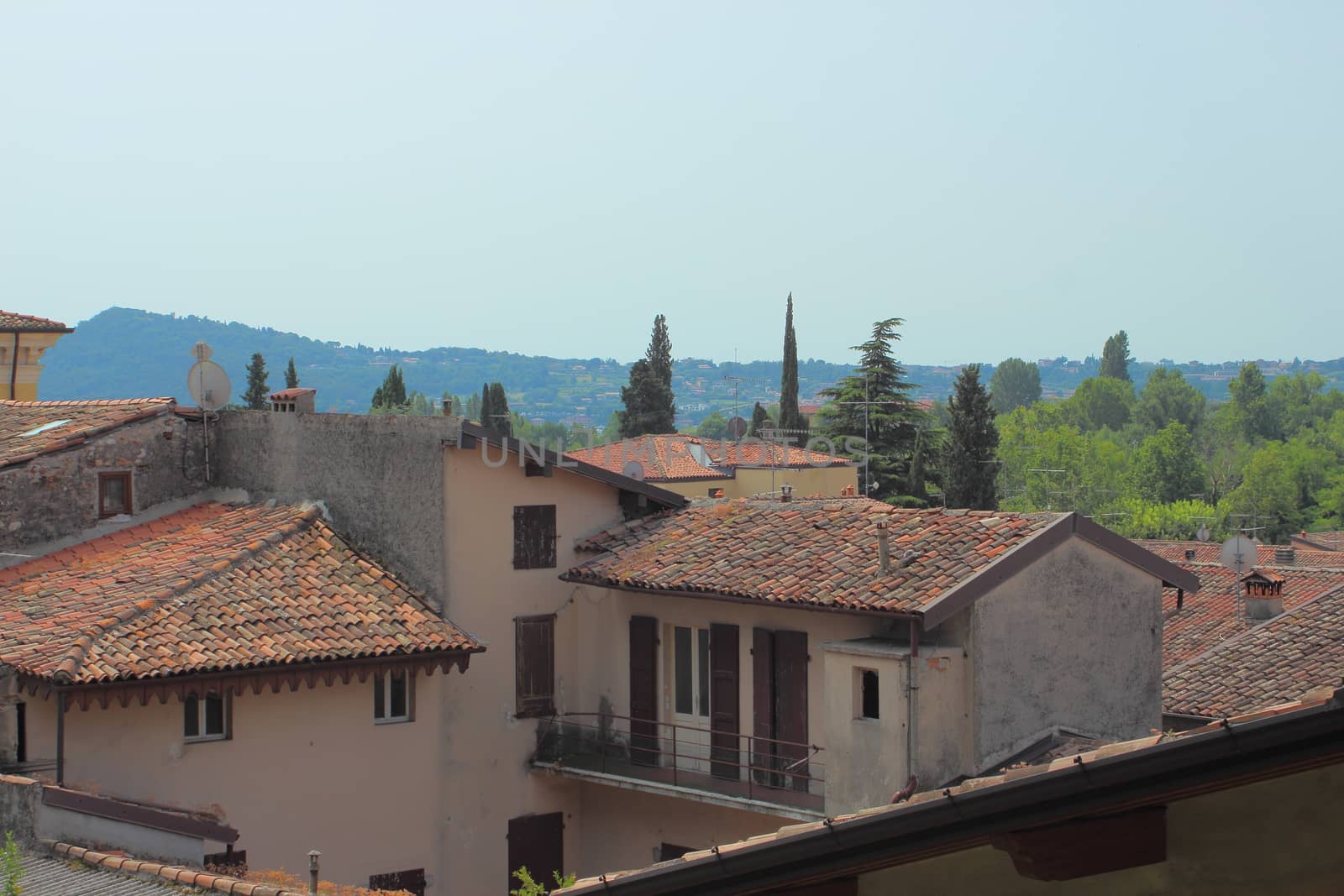 Scenic view over small italian village and hill side