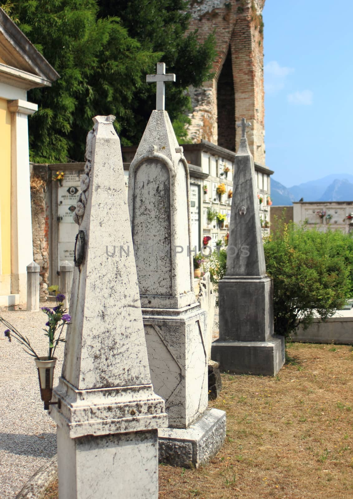 Tombstones at cemetery for urns in italian village