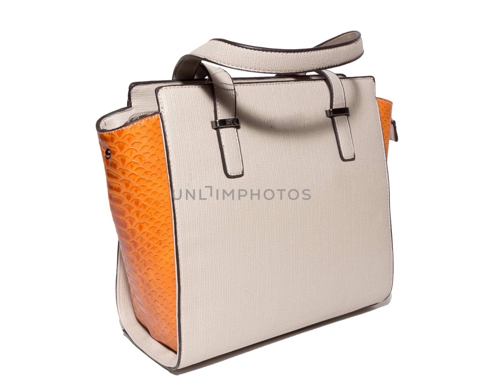 The photograph shows a female handbag on a white background