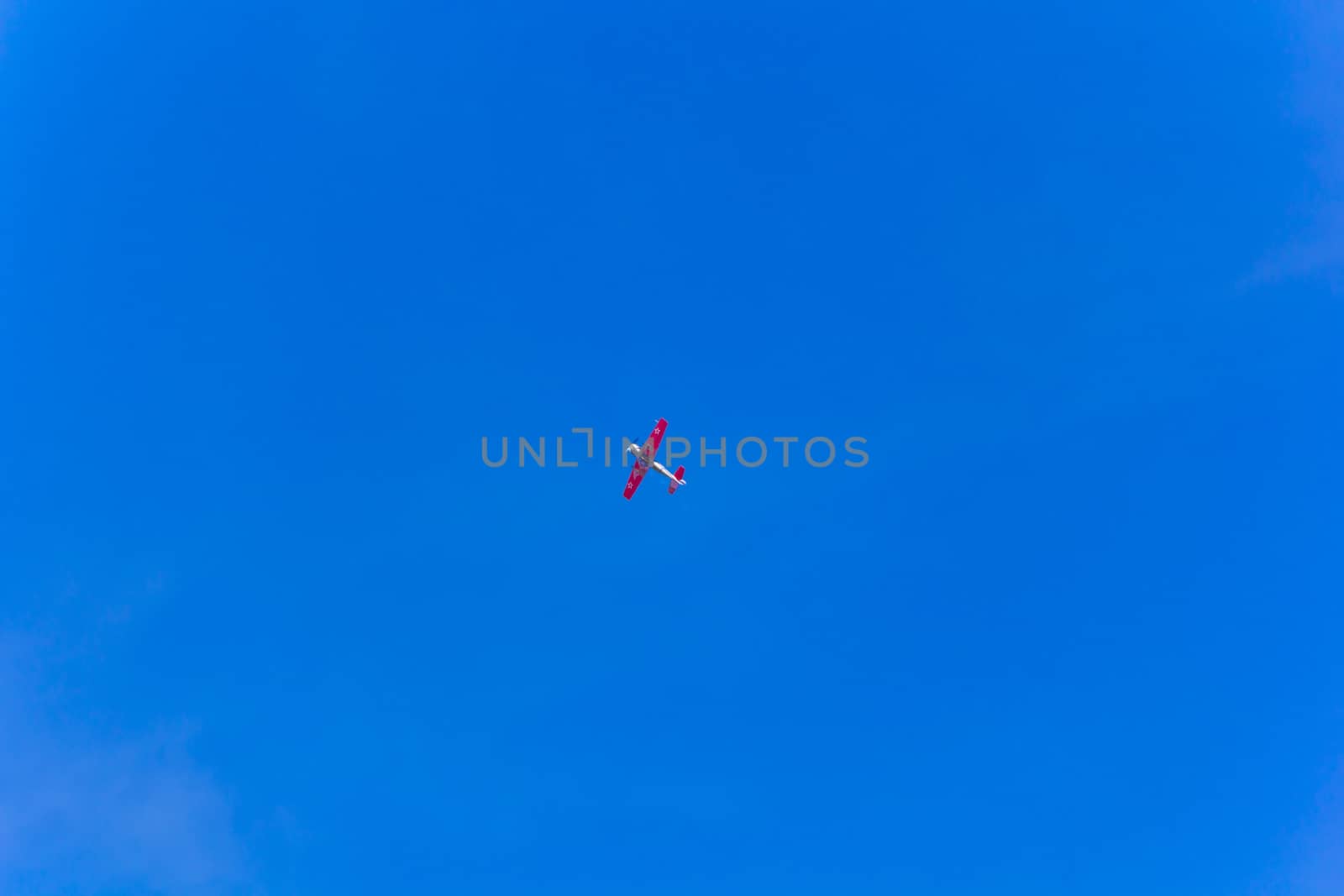 Photo of flying military plane in blue sky