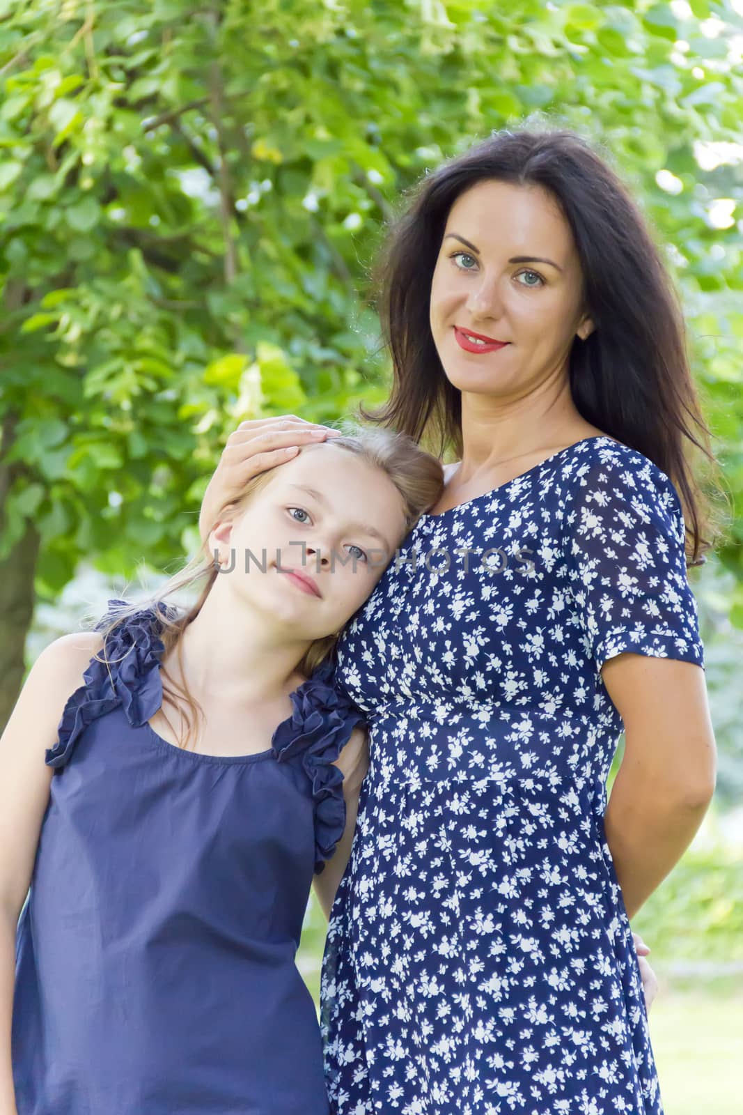 Portrait beautiful mother and daughter in summer