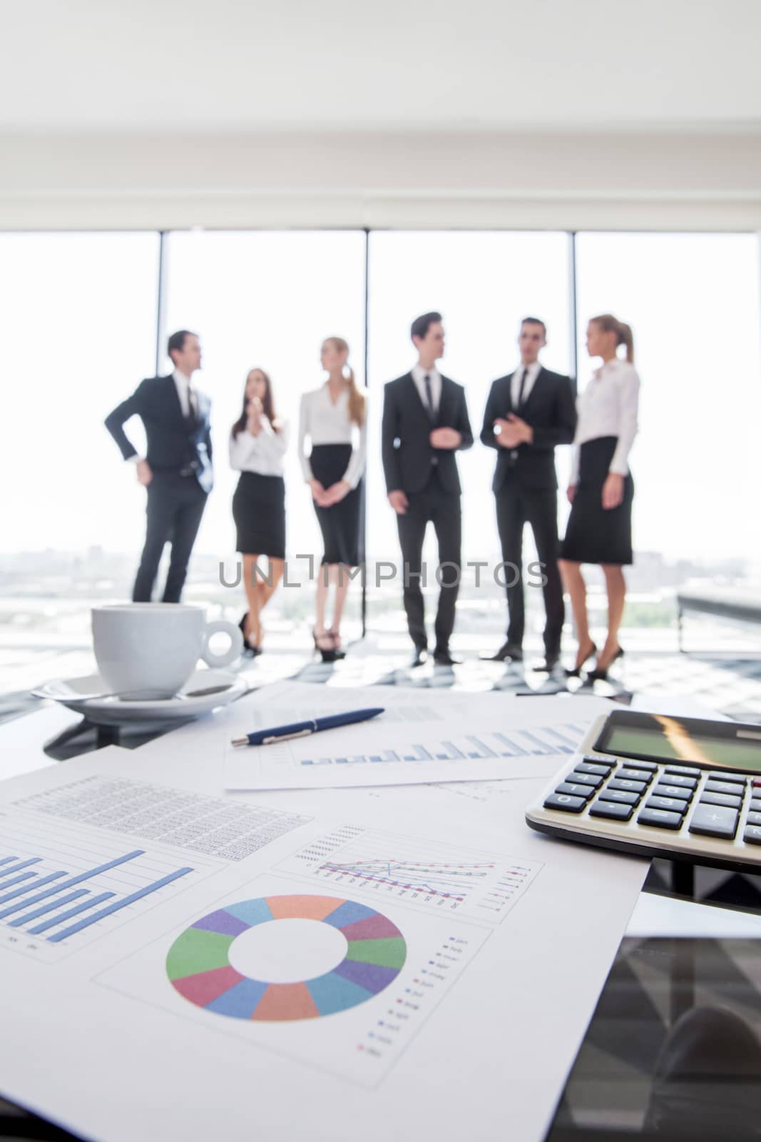 Business team and reports by ALotOfPeople
