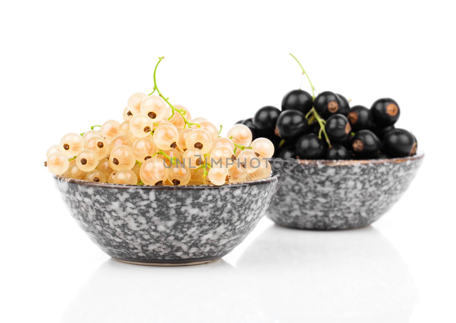 White currant fruit in a bowl, isolated over white background. by motorolka