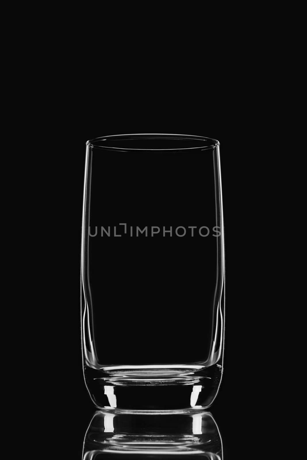 Empty glass on a black background by fotooxotnik