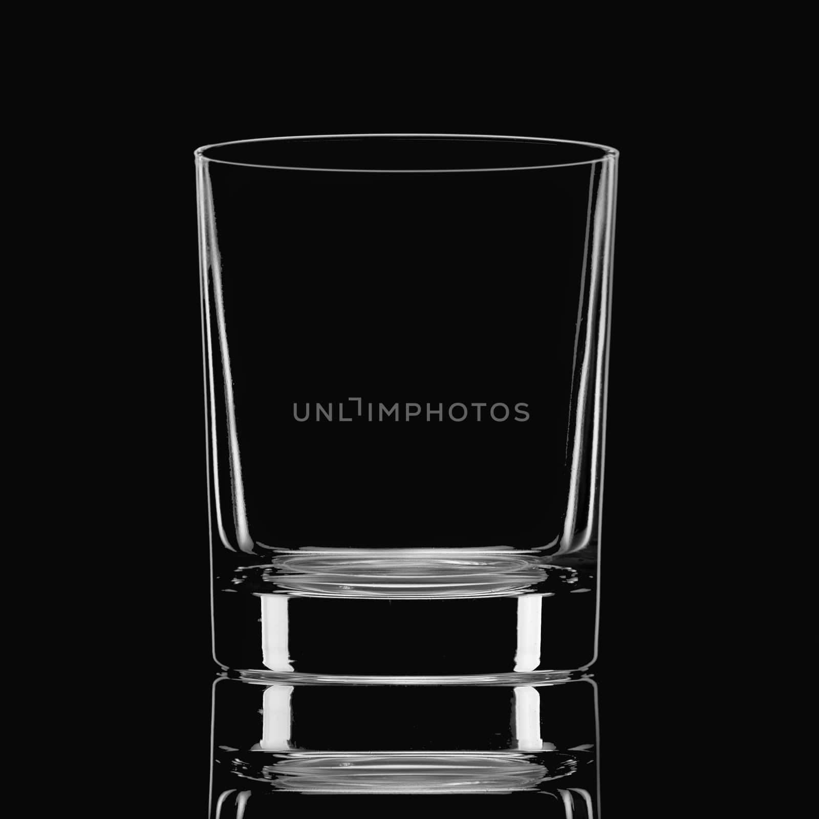 Empty glass on a black background by fotooxotnik