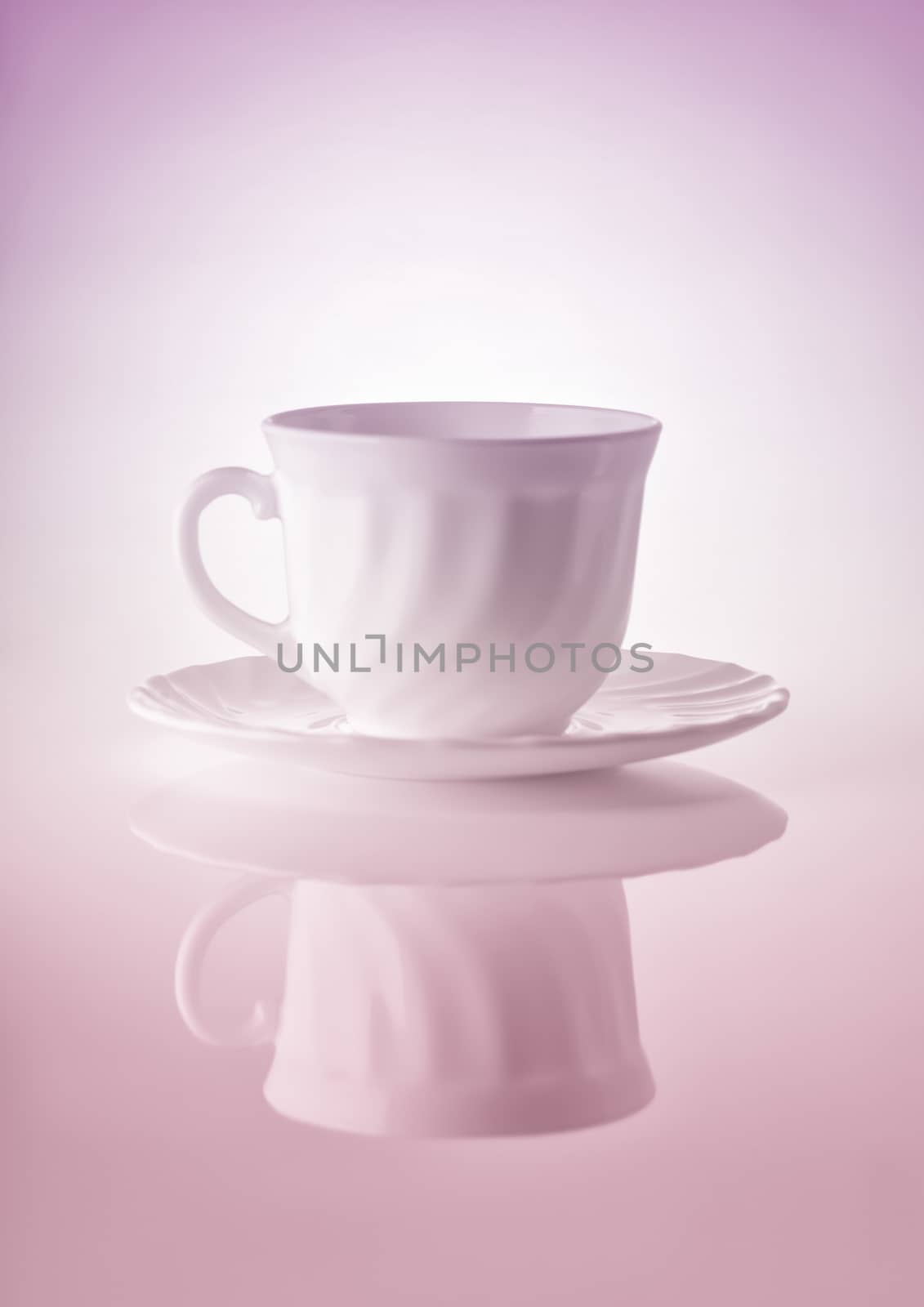 Cups for tea with saucers on a white background