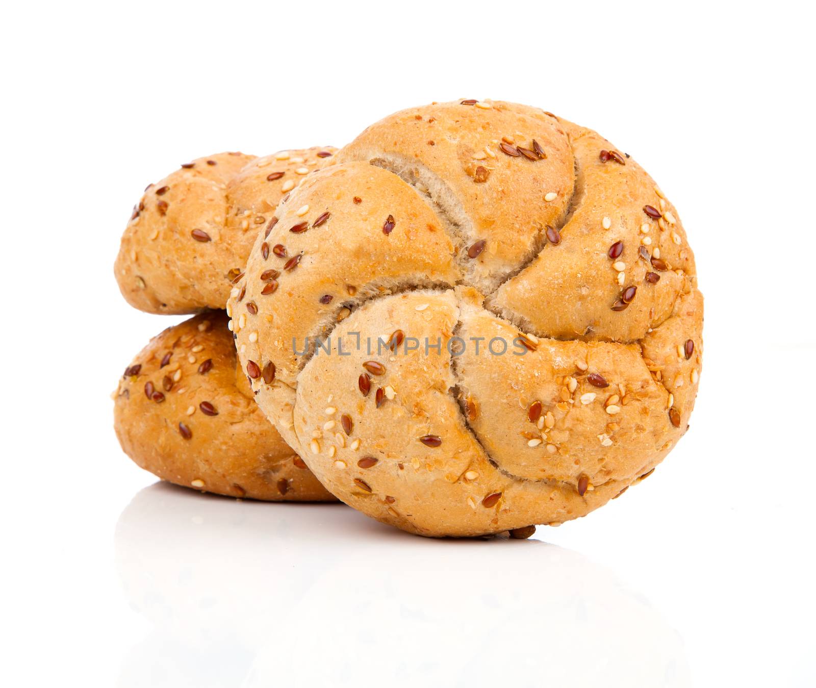 Kaiser roll with sesame seeds, on a white background by motorolka