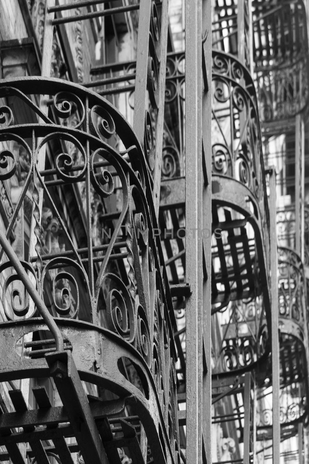 Close-up of some steel balconies with fire escape ladders