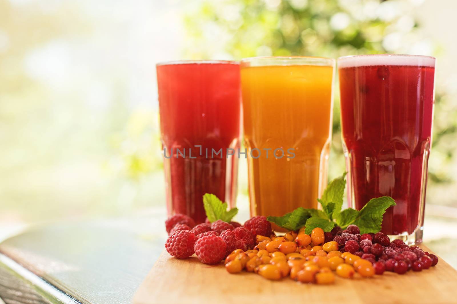 set of fruit non-alcoholic drink with cranberries raspberries and sea buckthorn