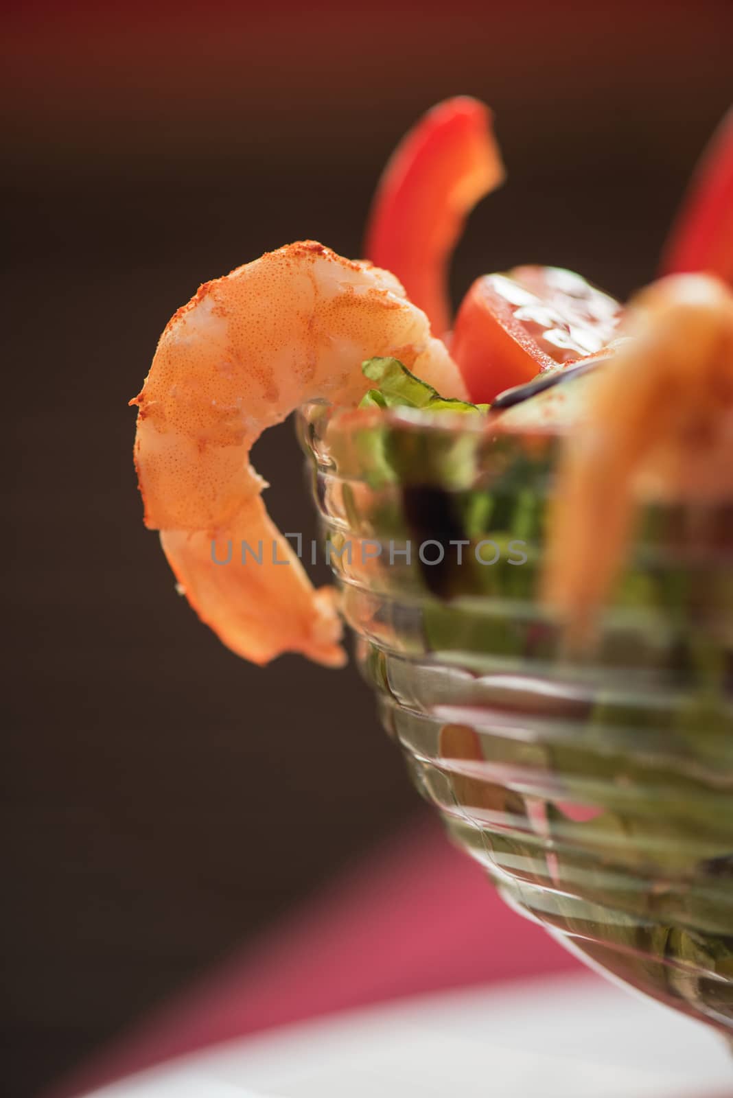 healthy green salad with cooked shrimp and vegetables