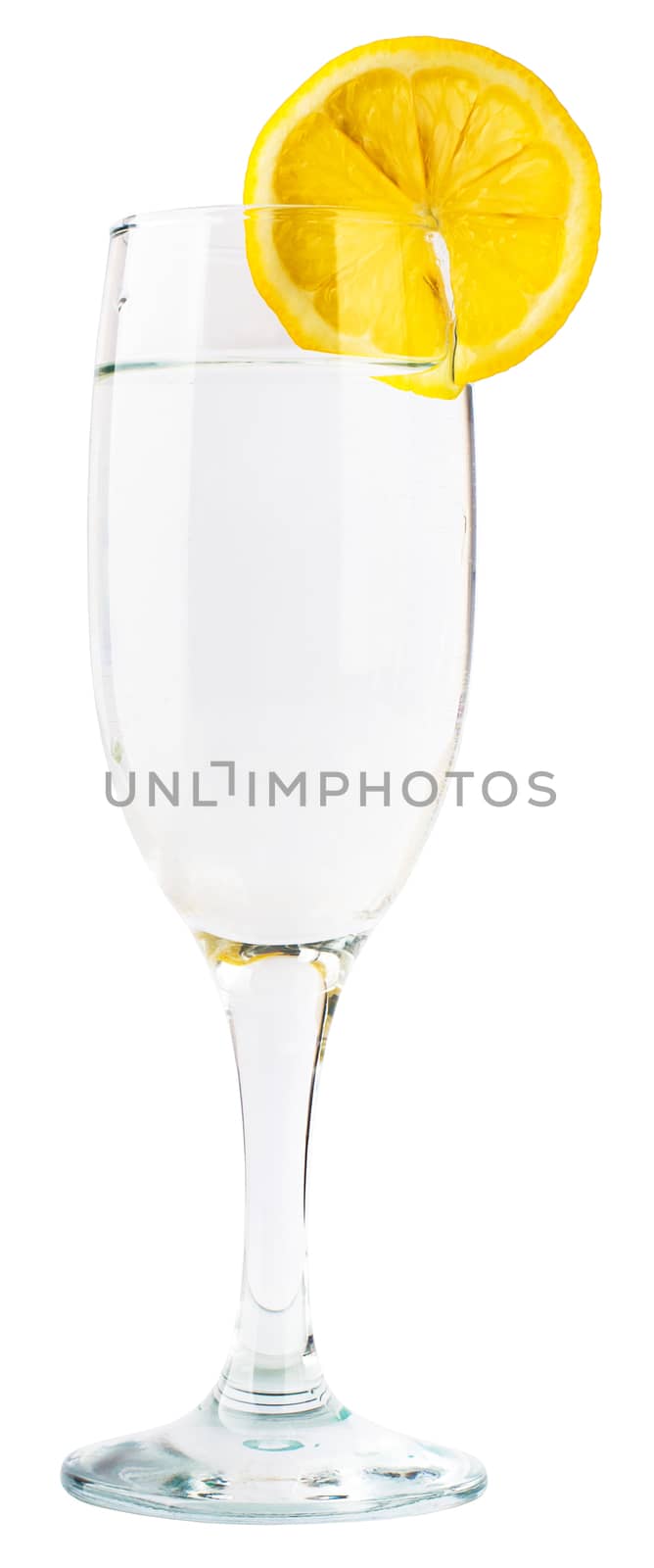 Glass of champagne with lemon slice by cherezoff