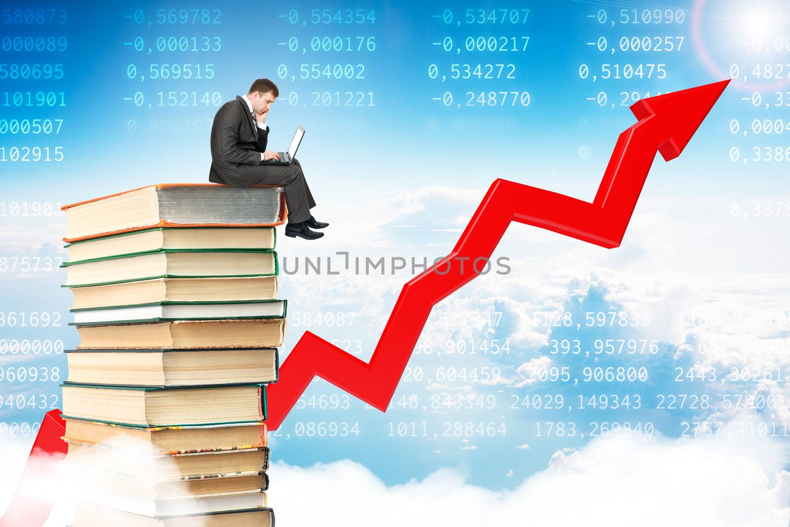 Businessman with laptop sitting on pile of books by cherezoff